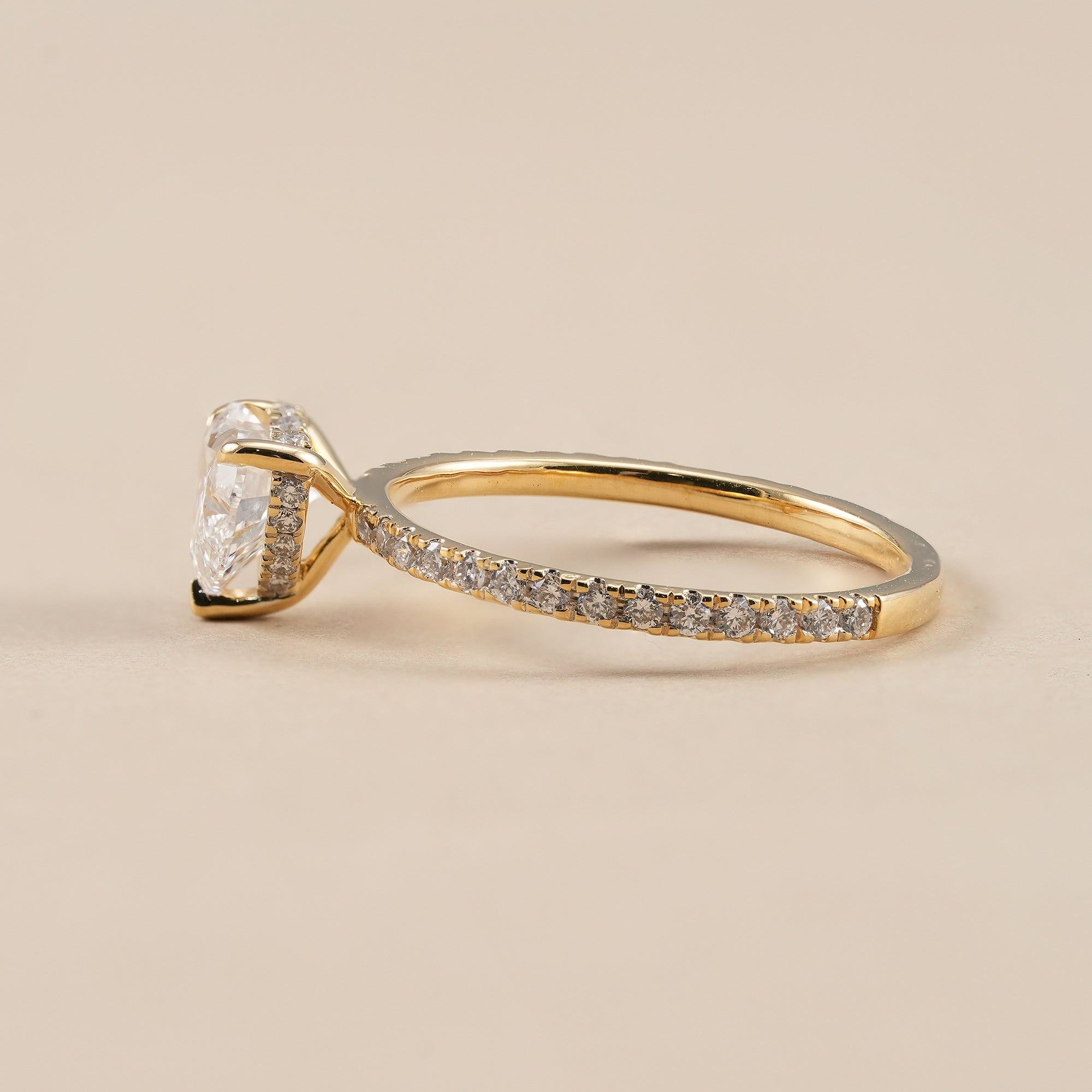 Heart diamond engagement ring with round pavé band
