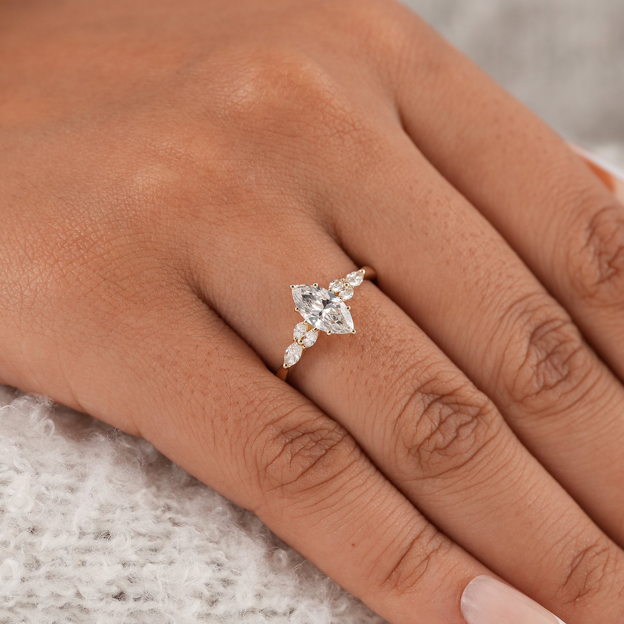 Luxury marquise proposal ring with cluster side stones