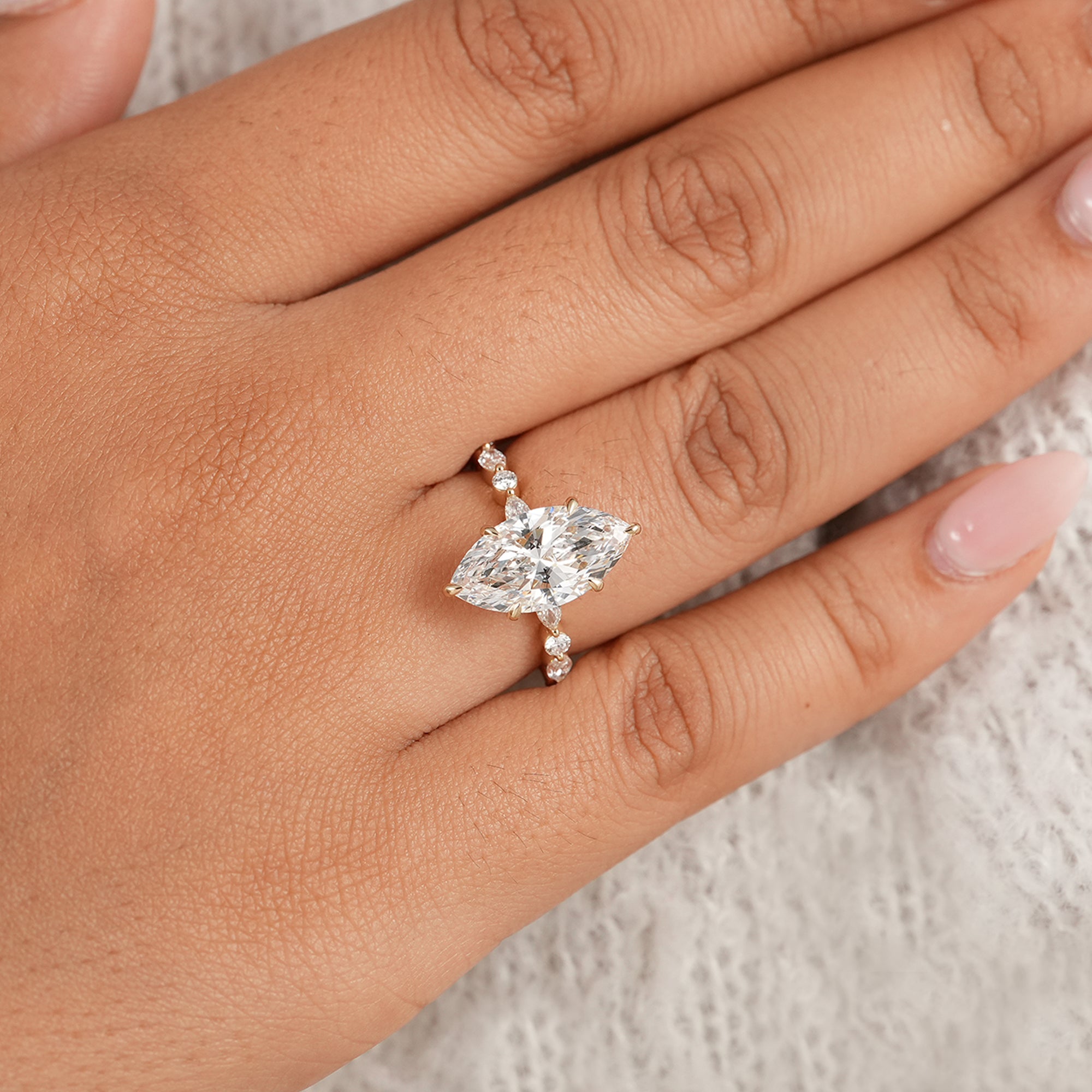 Marquise diamond engagement ring with alternating diamond band