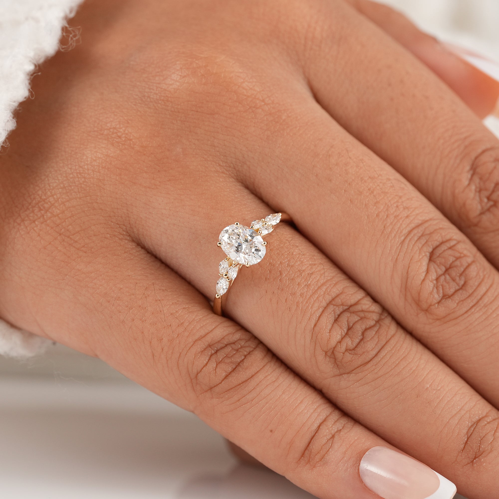 Oval cluster diamond engagement ring handcrafted in gold