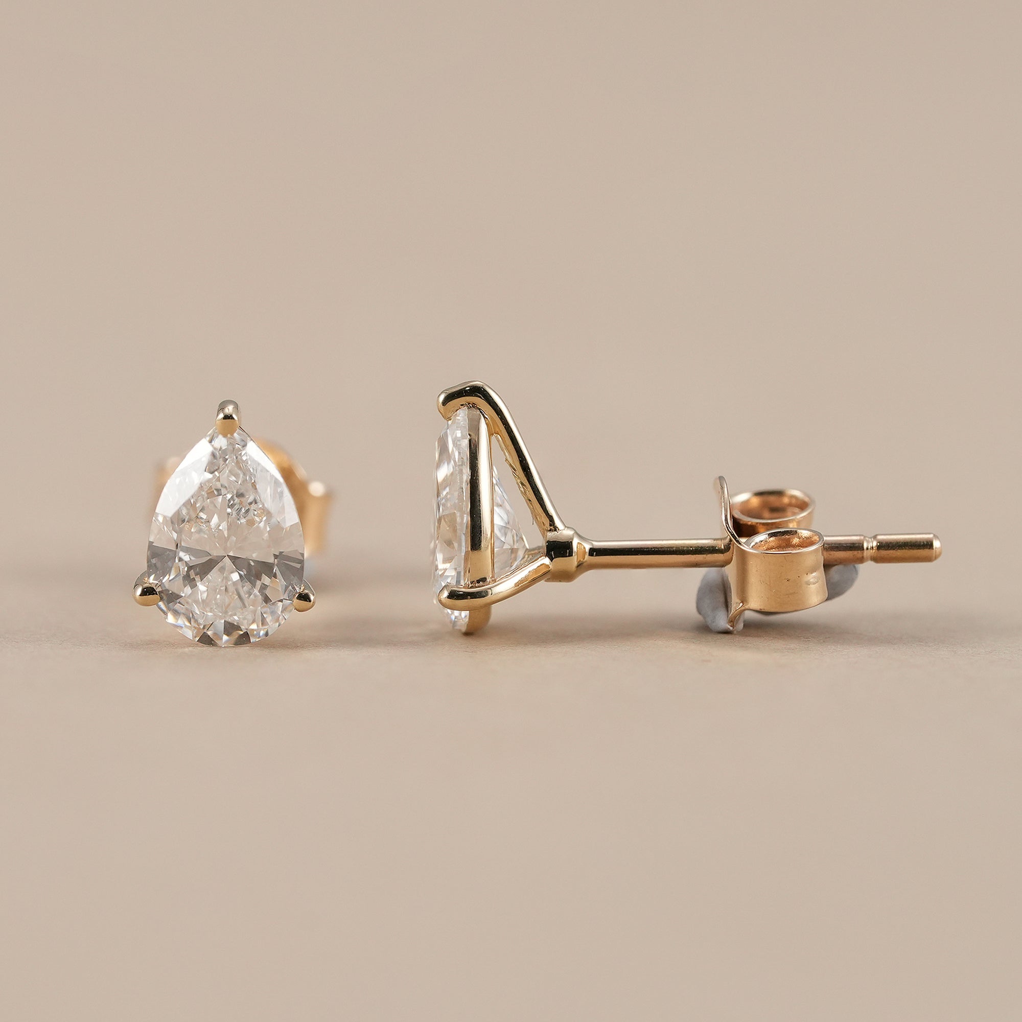 IGI certified pear solitaire diamond stud earrings