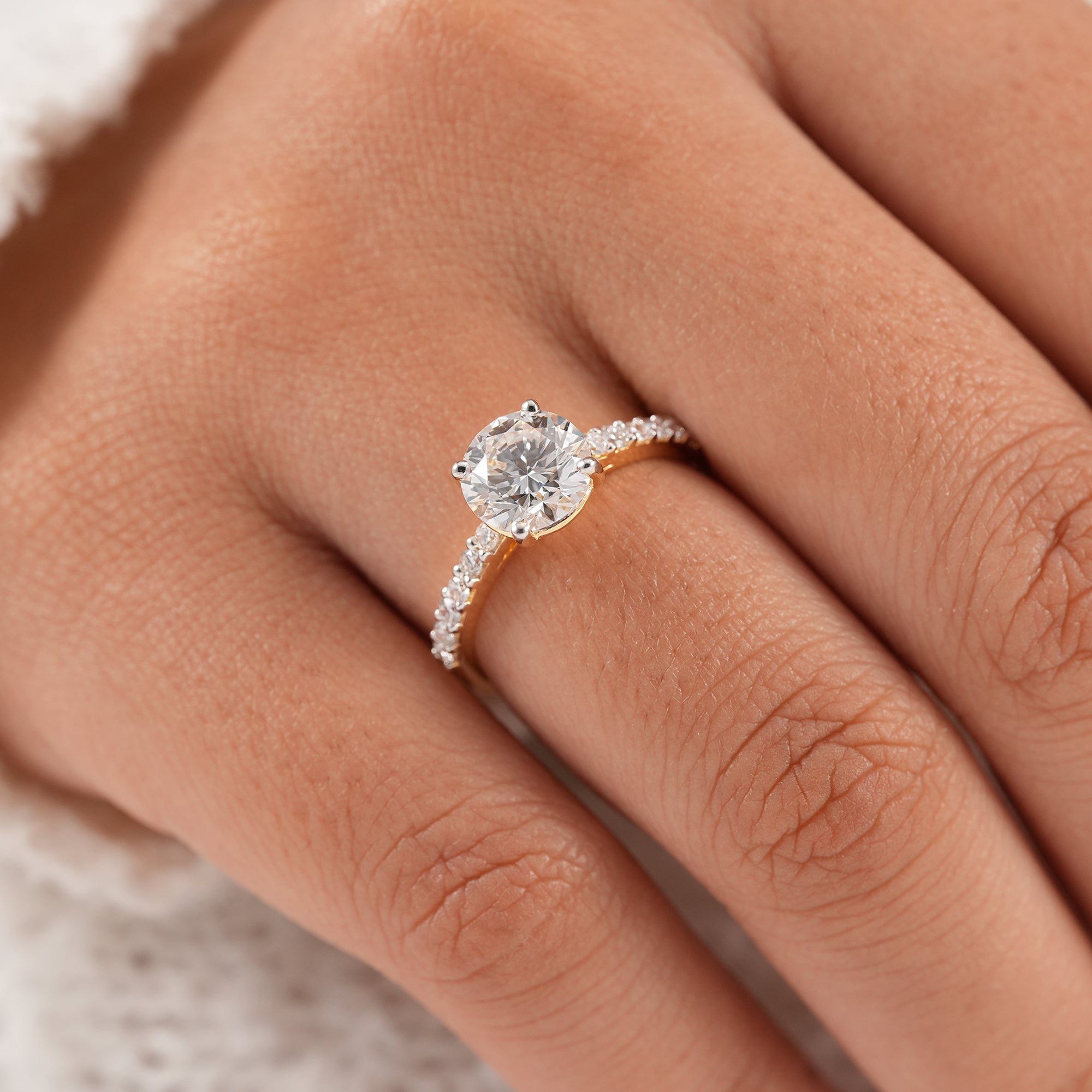 Handmade round diamond wedding ring with pavé accents