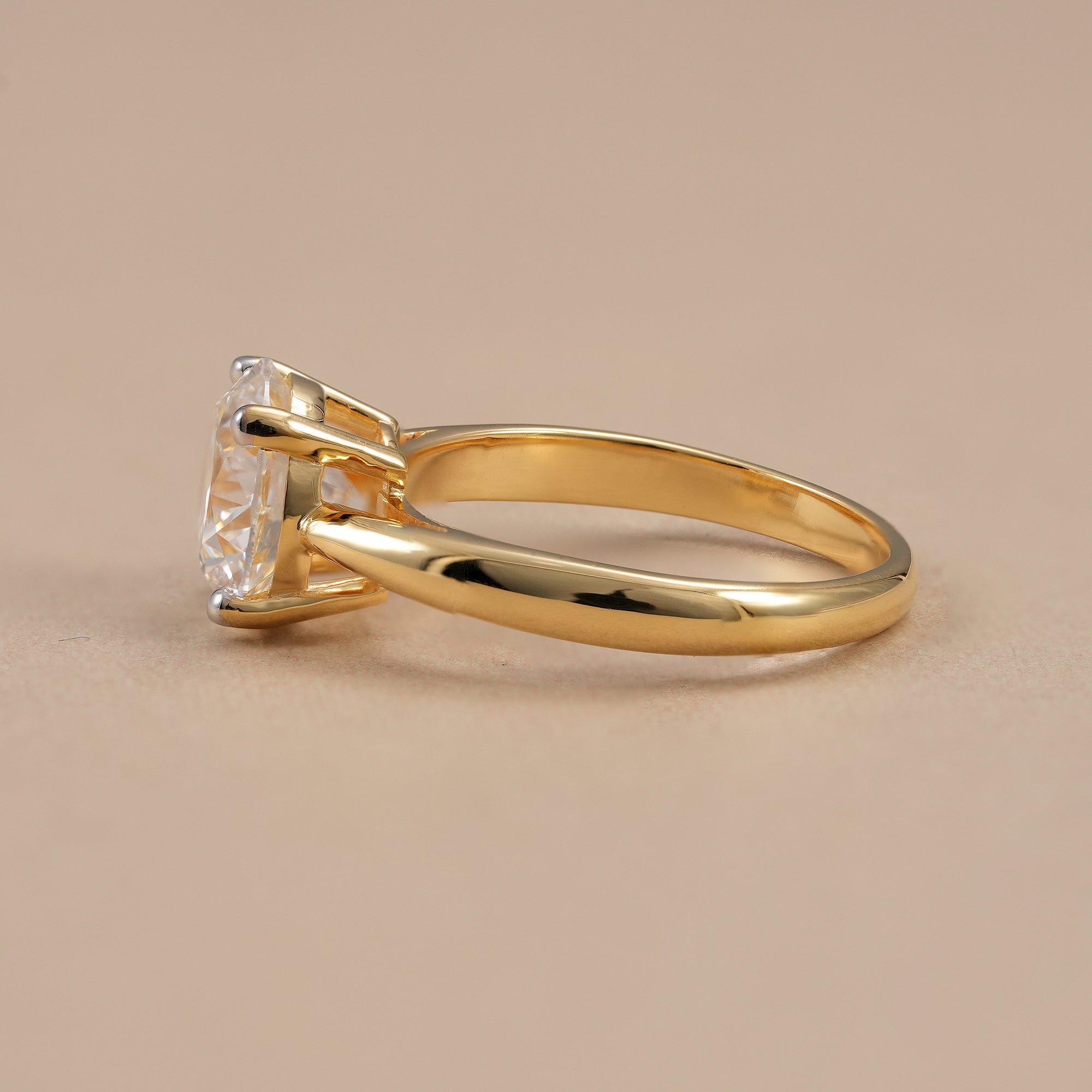 Minimalist round diamond ring with secure four prong setting