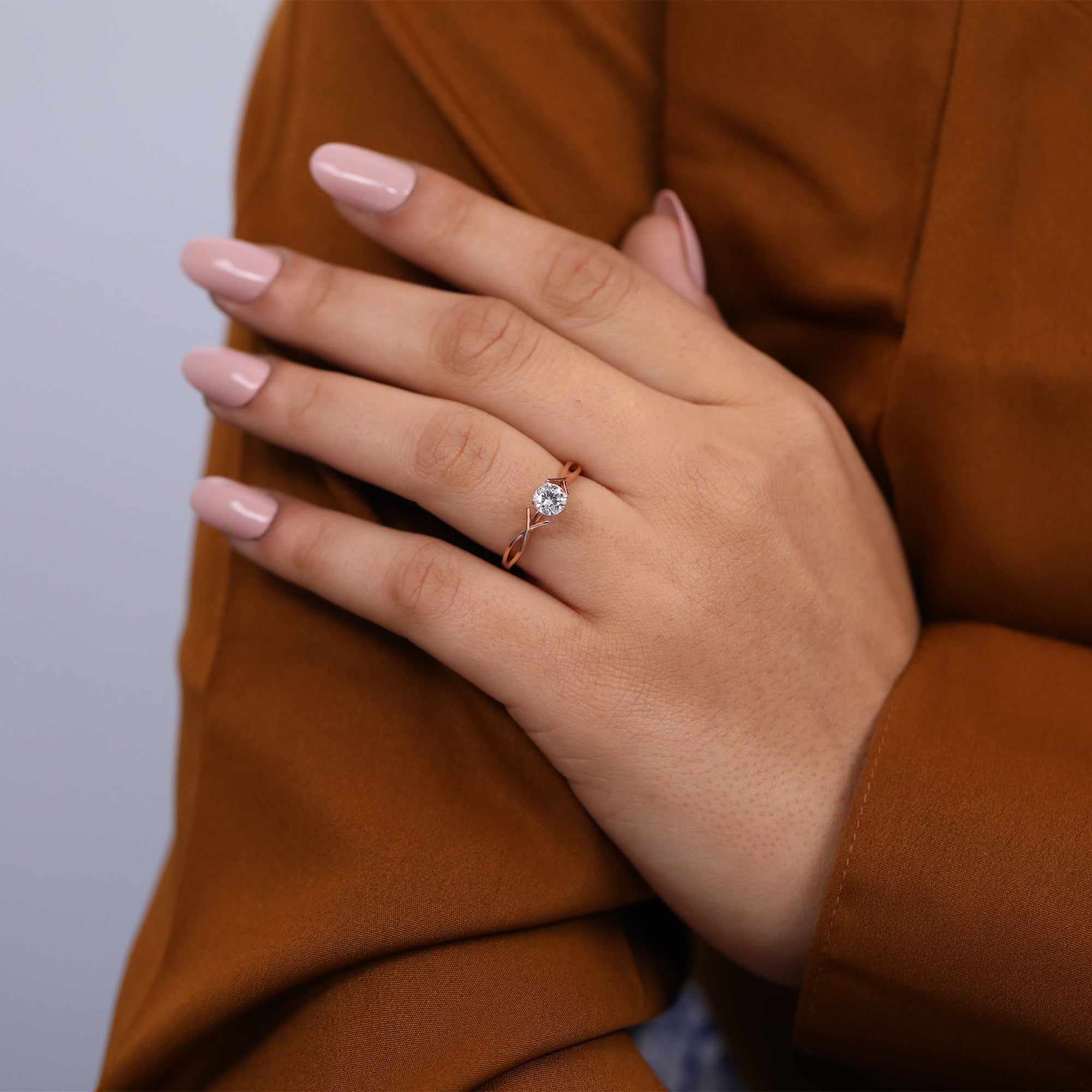Twist shank lab grown diamond solitaire engagement ring in rose gold