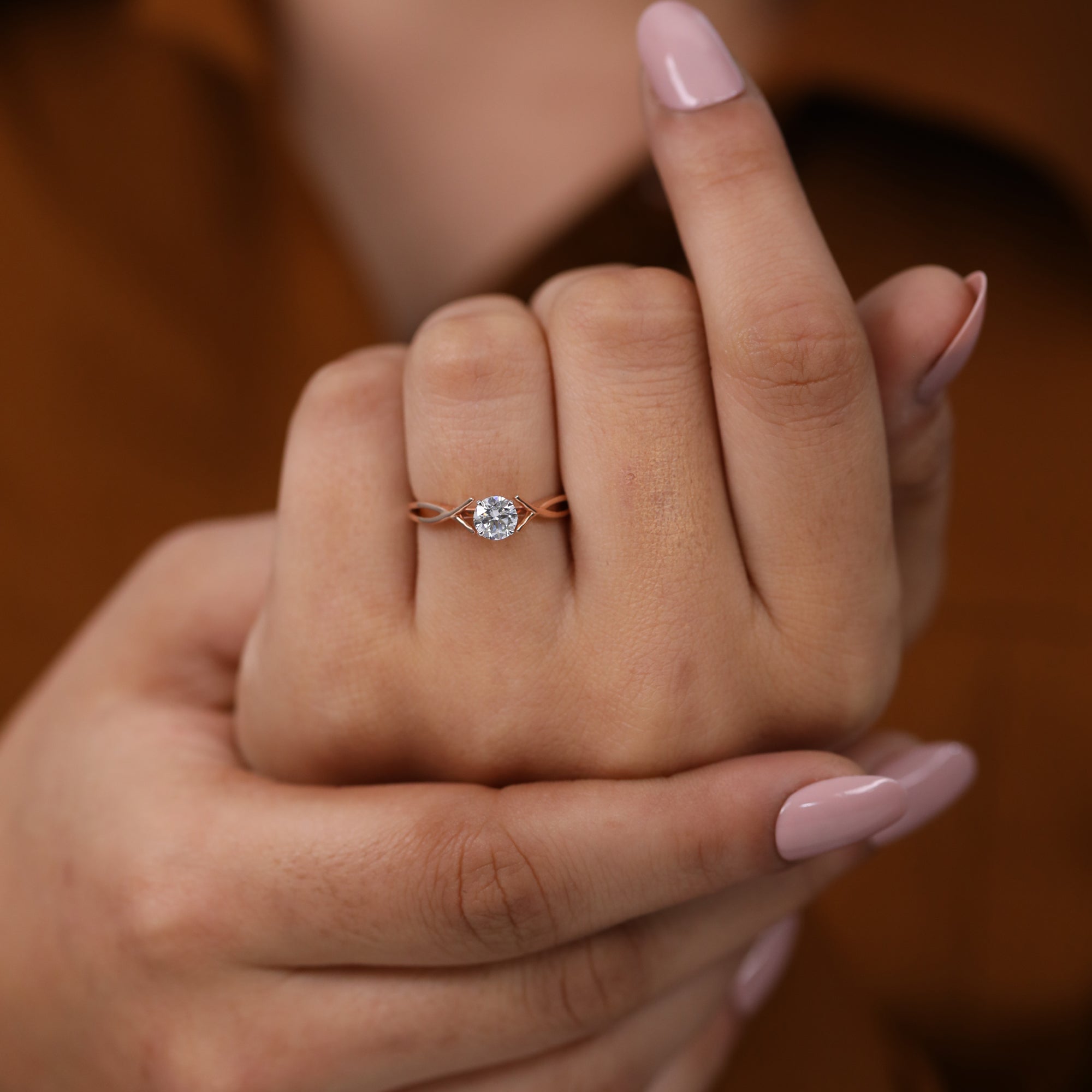 Classic round lab grown diamond solitaire ring with a unique rose gold twist band
