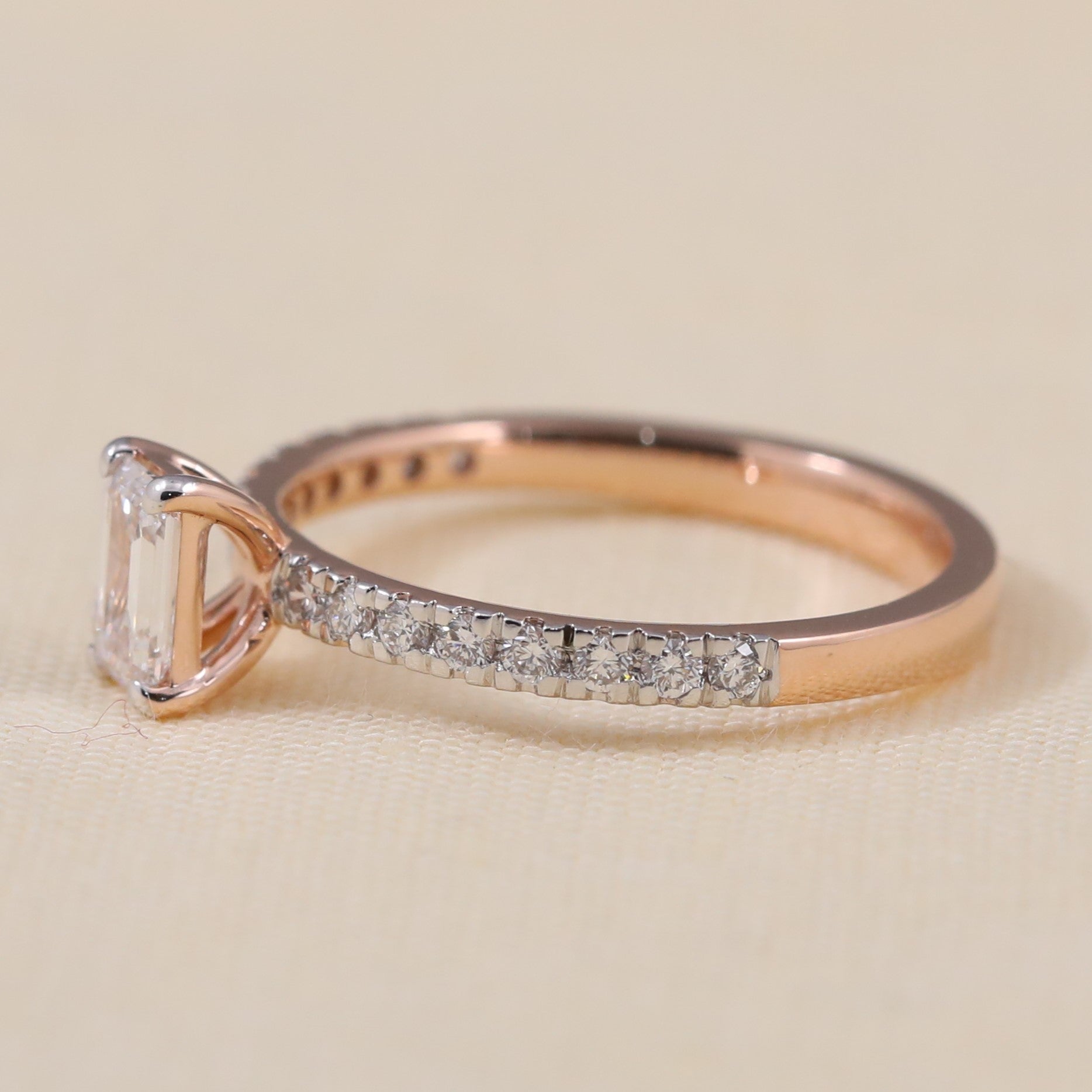 Timeless emerald cut lab grown diamond ring accented by shimmering pavé stones