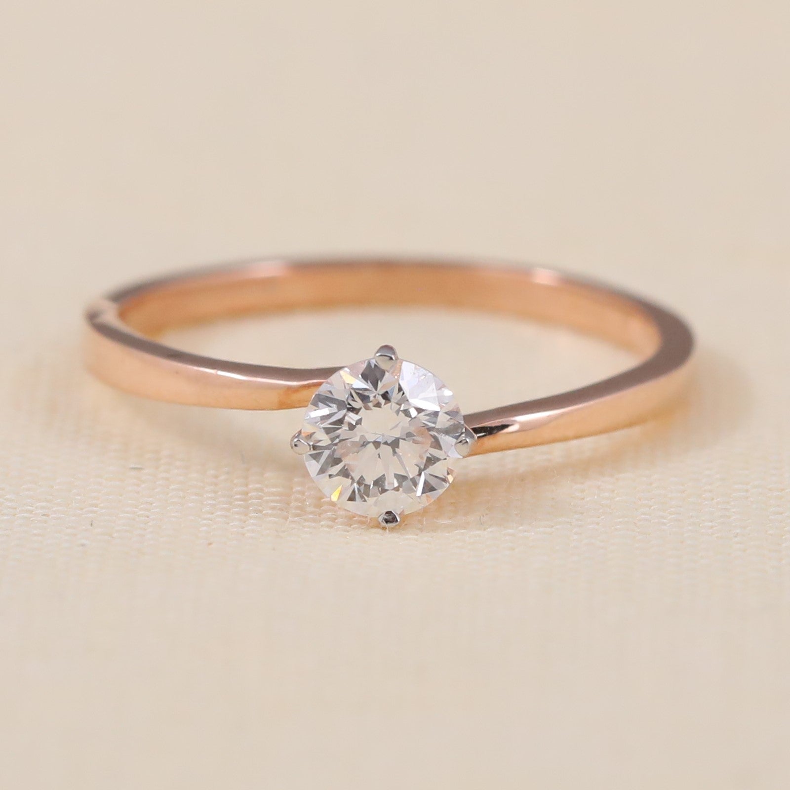 Round lab grown diamond solitaire ring featuring a clean, minimalist band design
