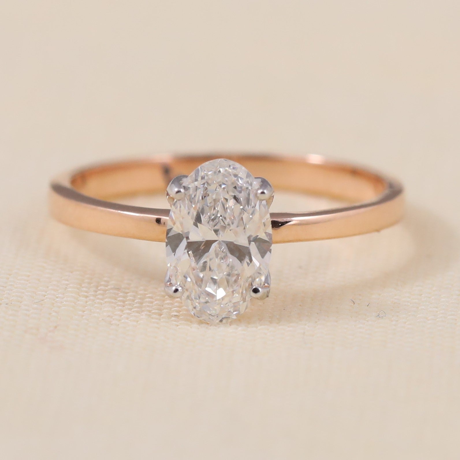 Oval lab-grown diamond solitaire ring featuring a clean, minimalist band design