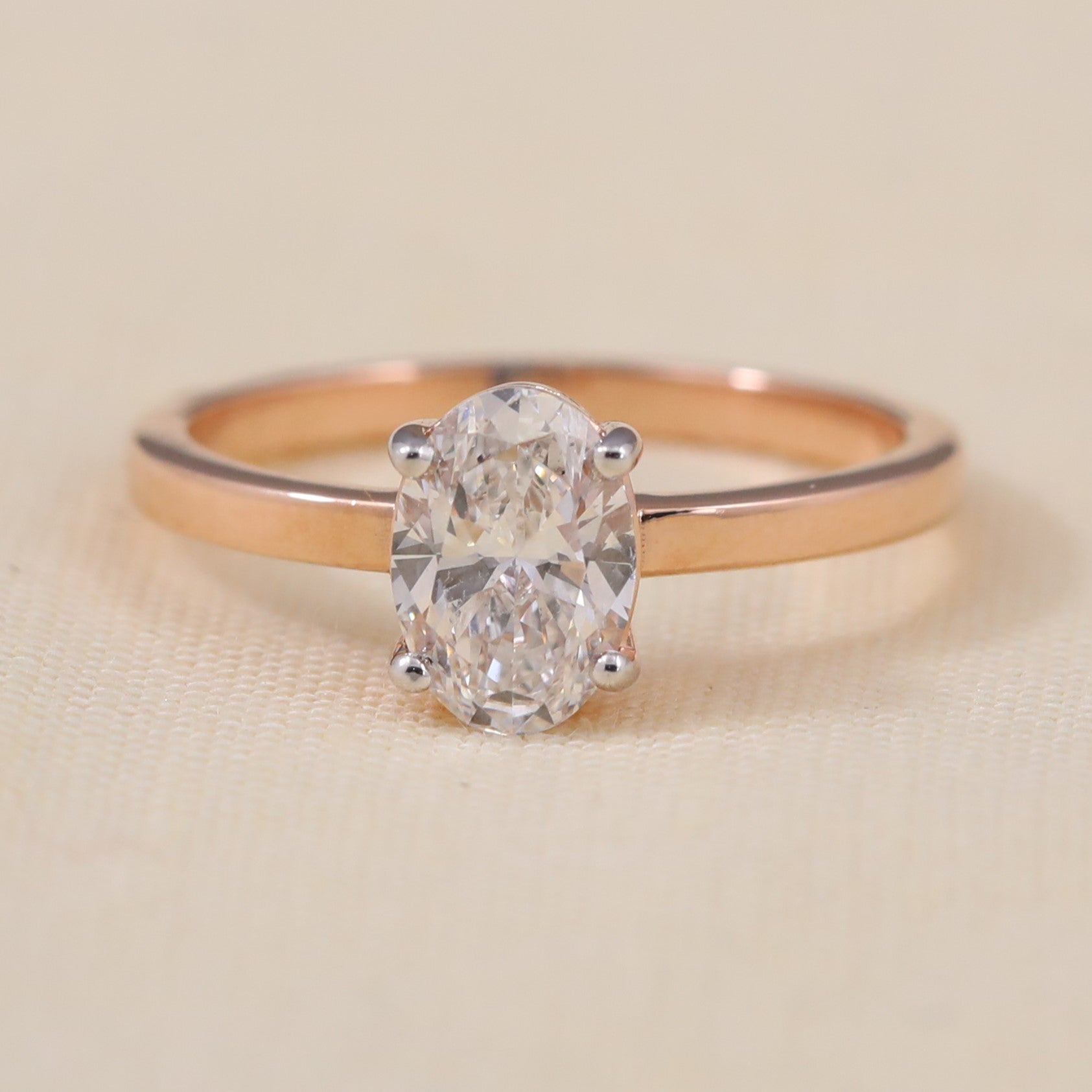 Oval lab grown diamond solitaire ring featuring a clean, modern band design