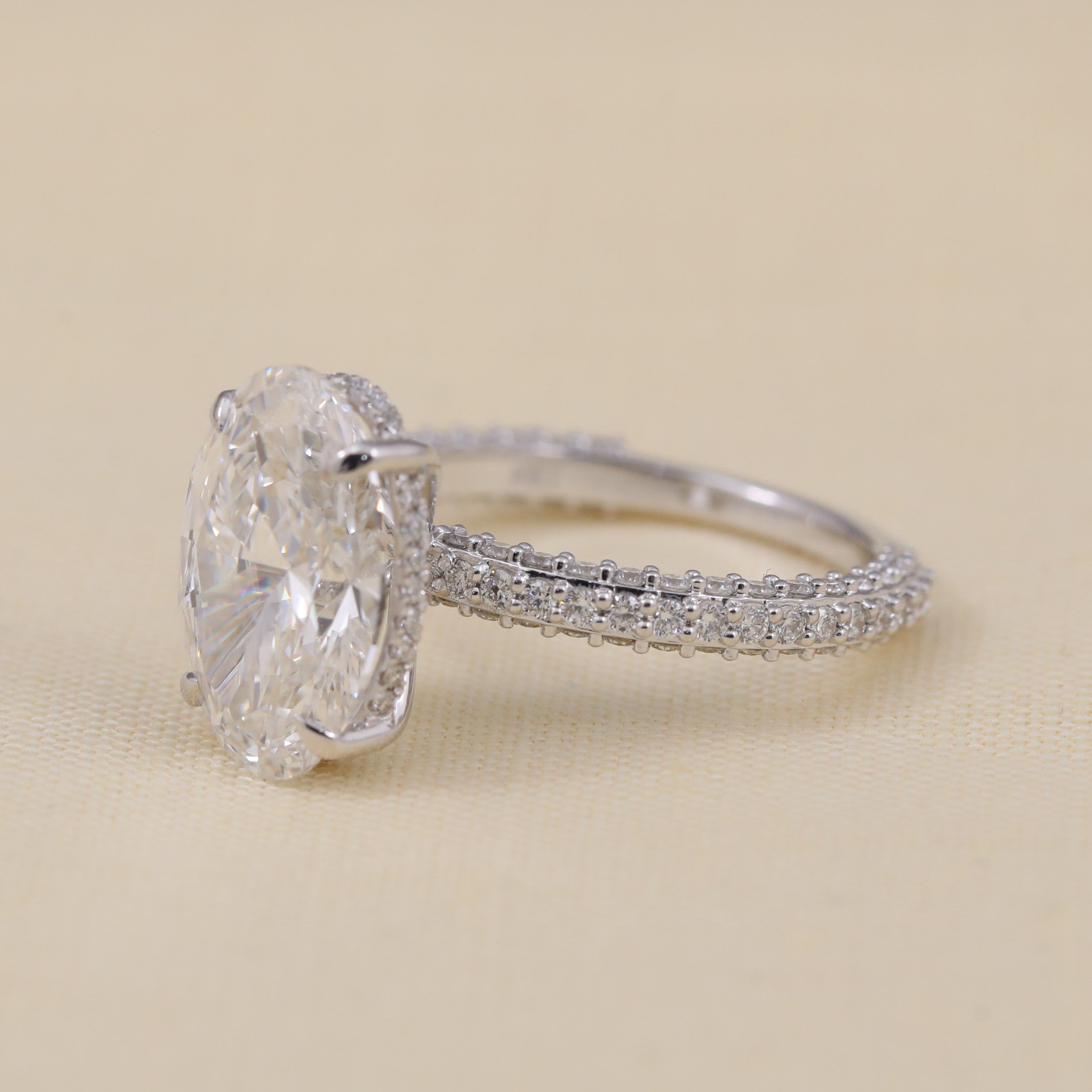 Elegant oval lab grown diamond ring with detailed pavé shank