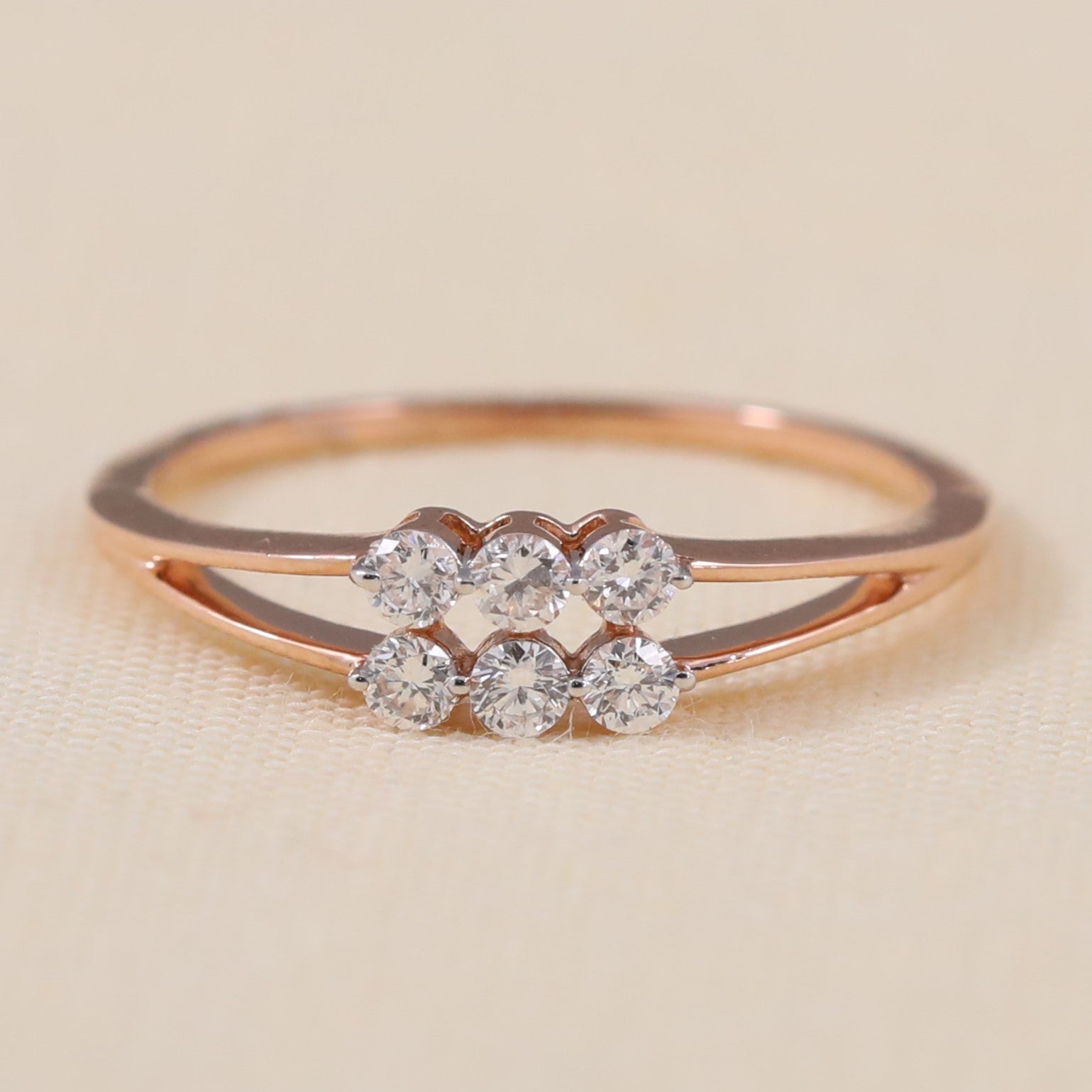 Elegant split band ring with shimmering lab grown diamond floral cluster.