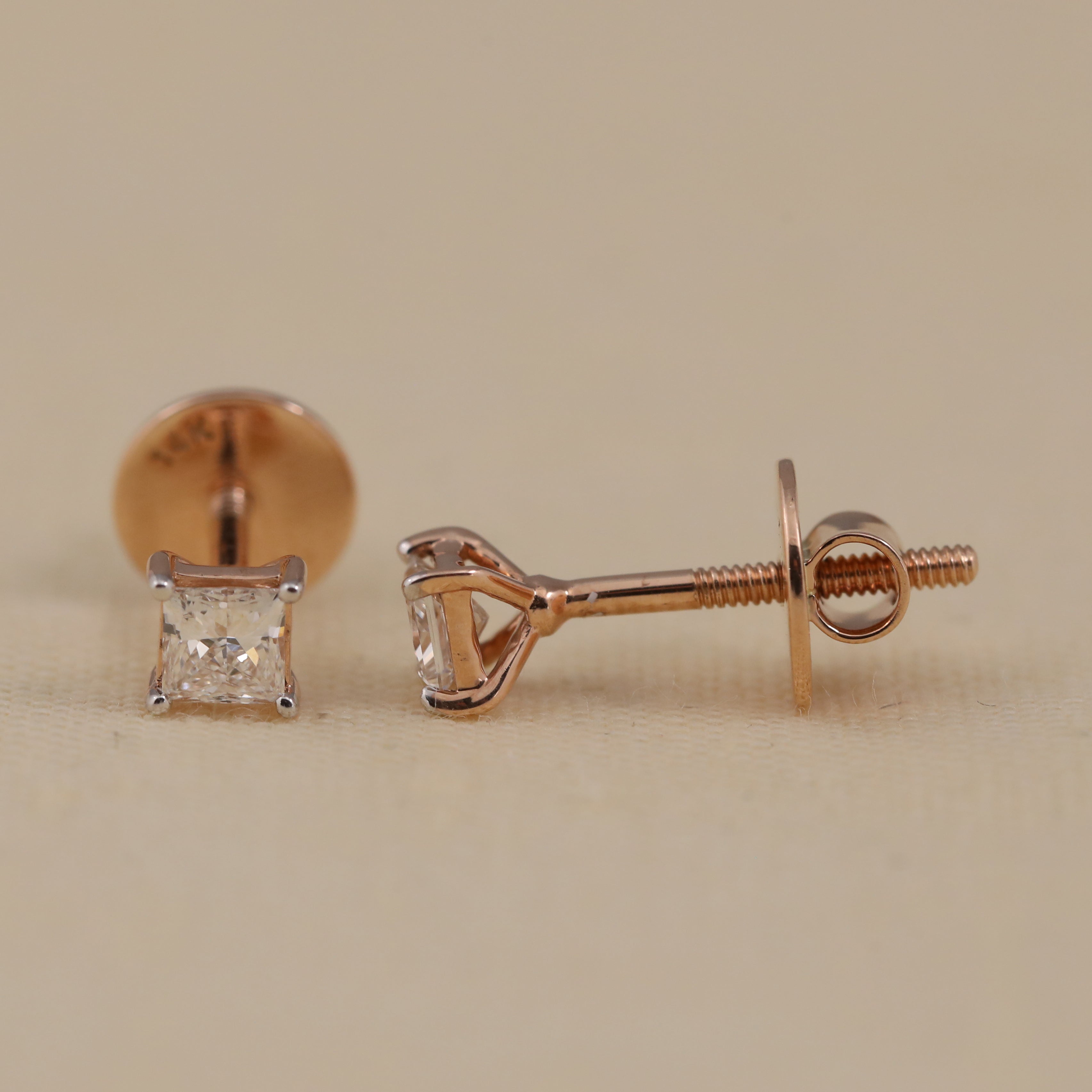 Classic princess-cut diamond earrings suited for daily wear and parties.