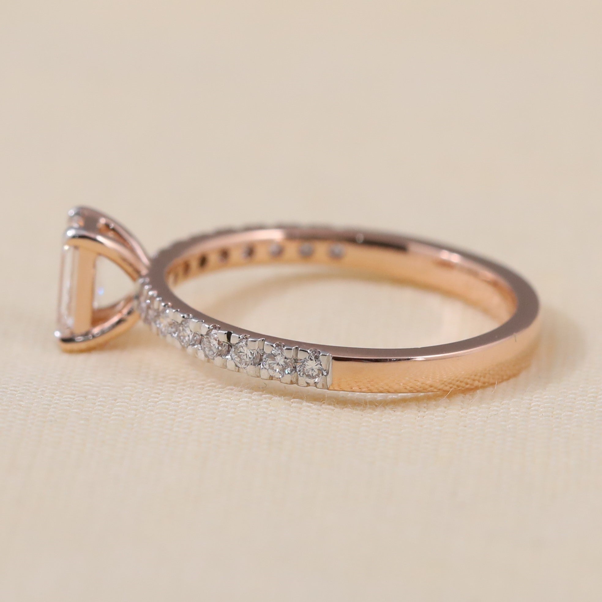 Elegant pavé band ring showcasing a brilliant emerald cut lab grown diamond