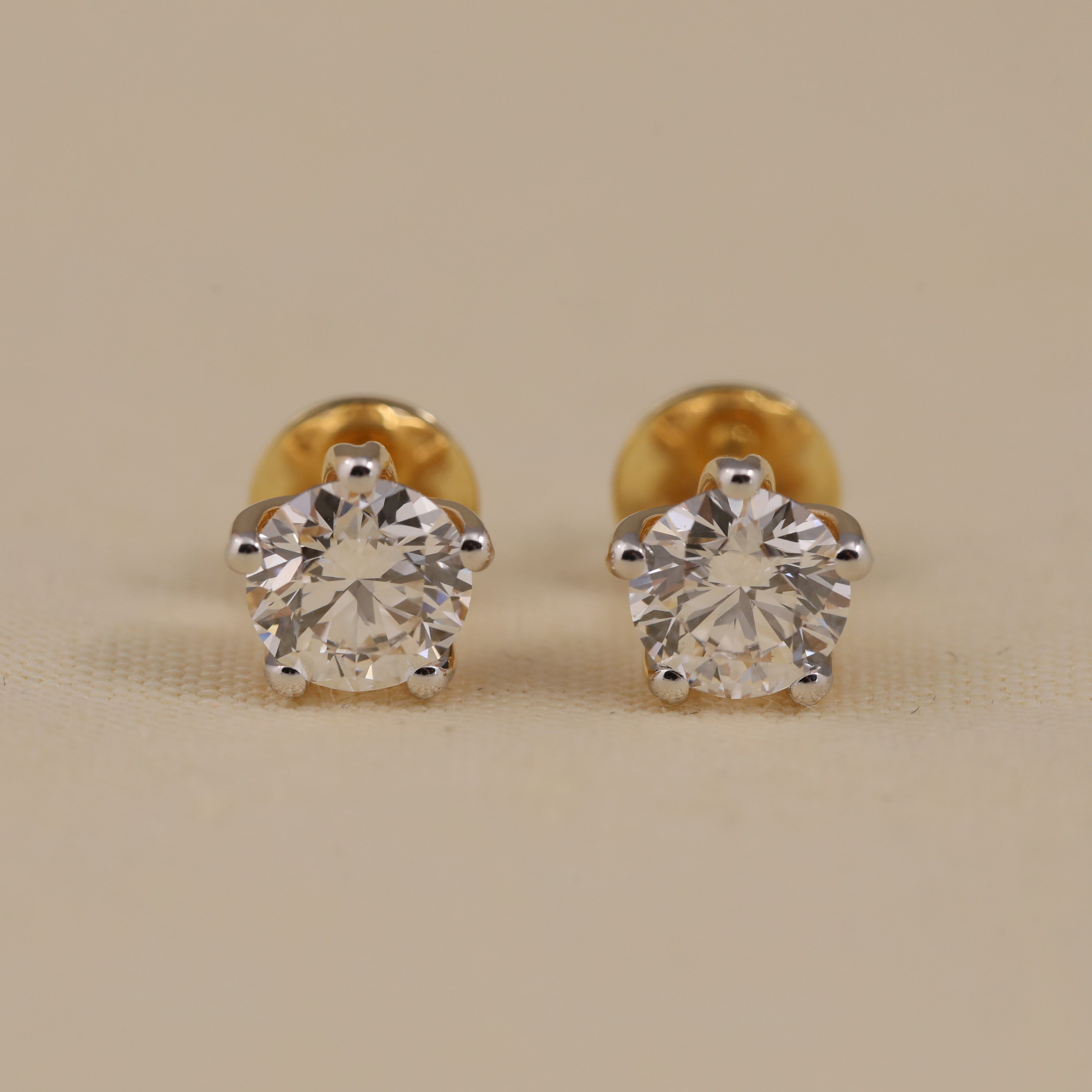 Round solitaire diamond stud earrings perfect for wedding or anniversary gifting.
