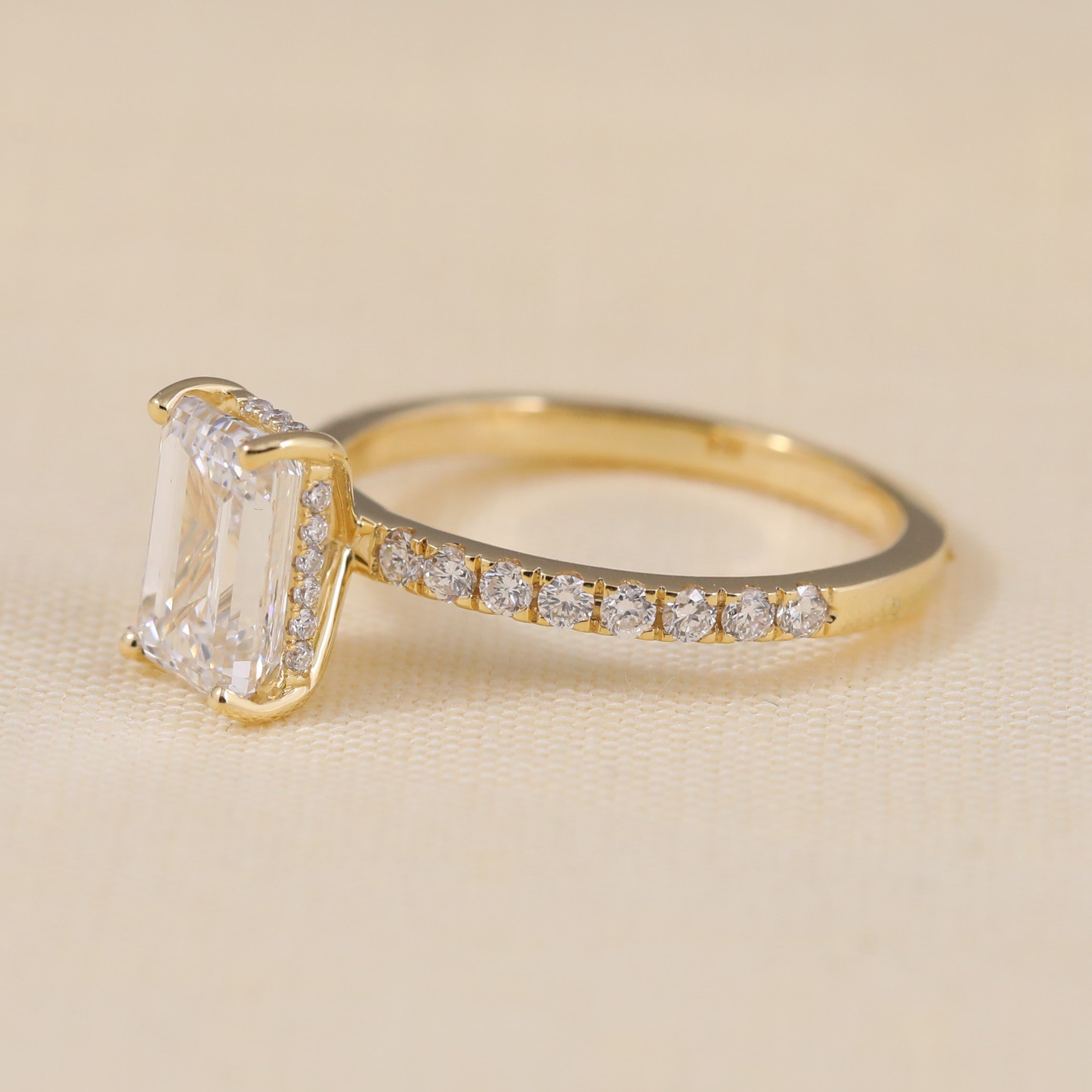 Radiant cut engagement ring on hand showcasing elegant sparkle and clarity.