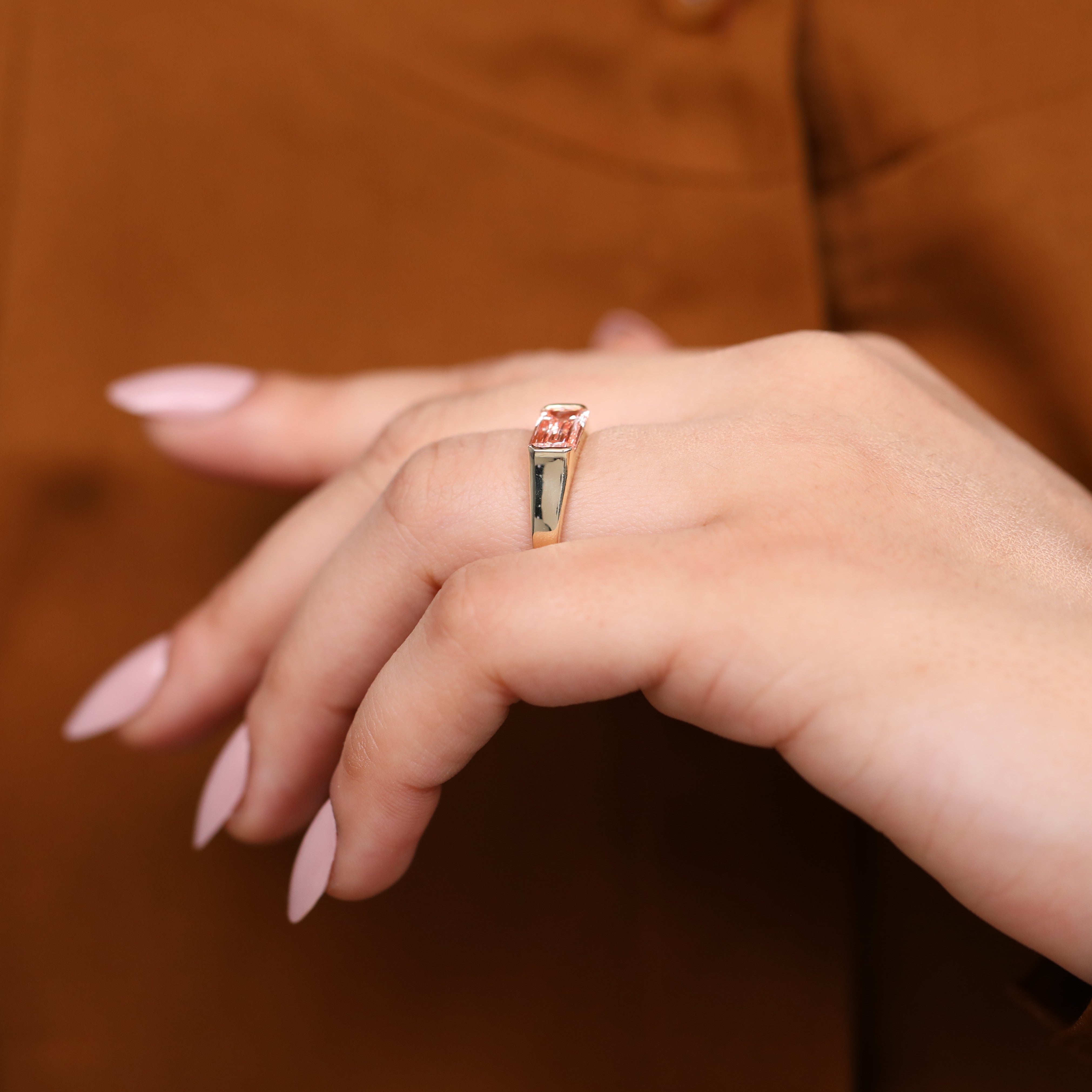 Pink emerald cut lab diamond solitaire ring in gold for women.