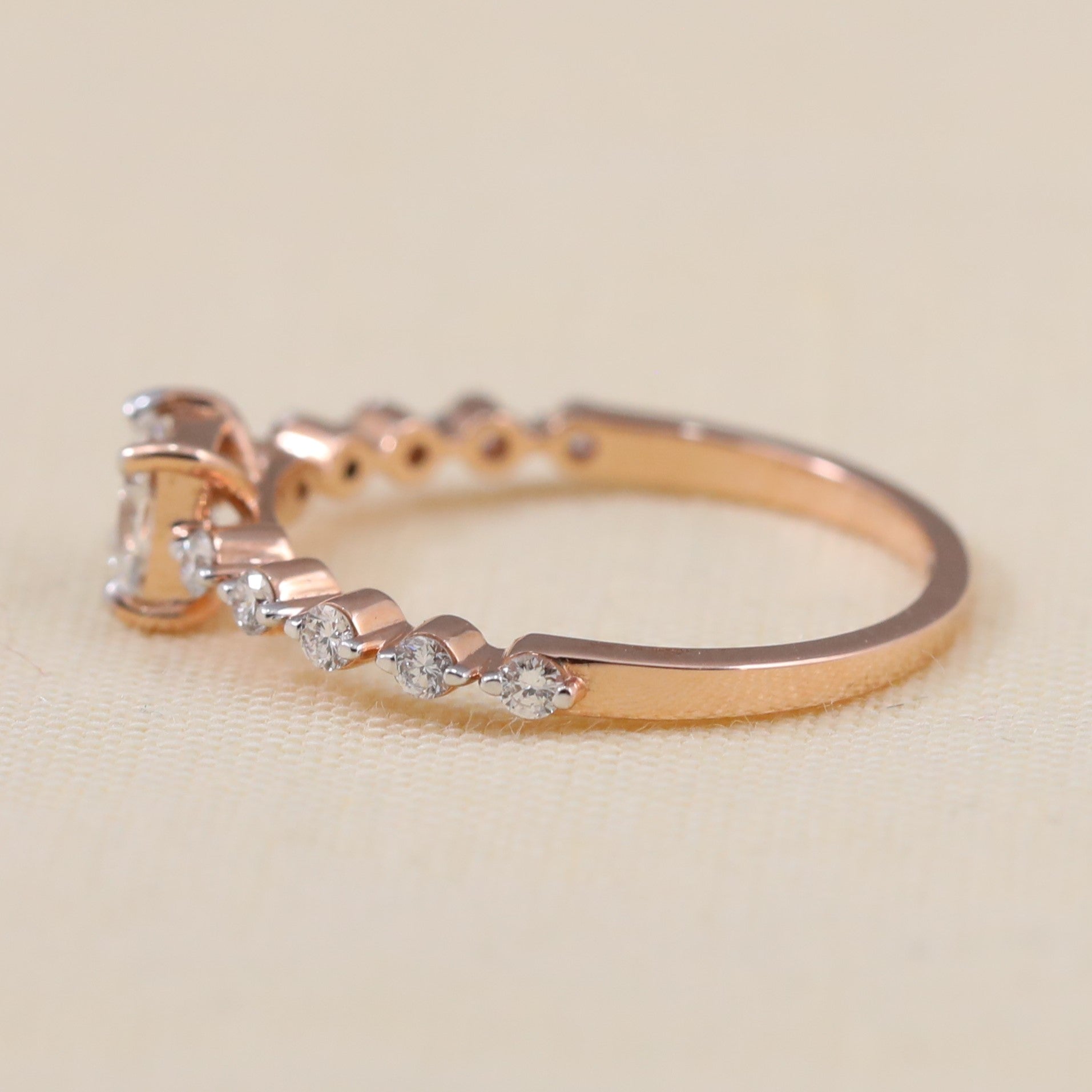 Cushion cut lab grown diamond promise ring featuring brilliant round side stones