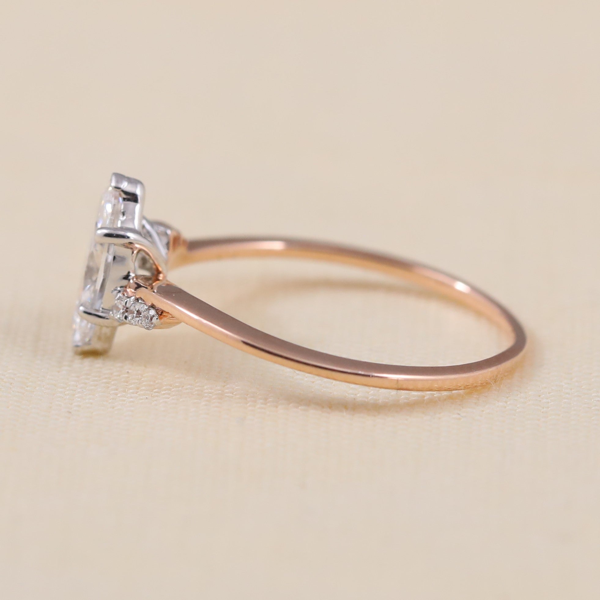 Marquise lab grown diamond engagement ring crafted with tapered side stones