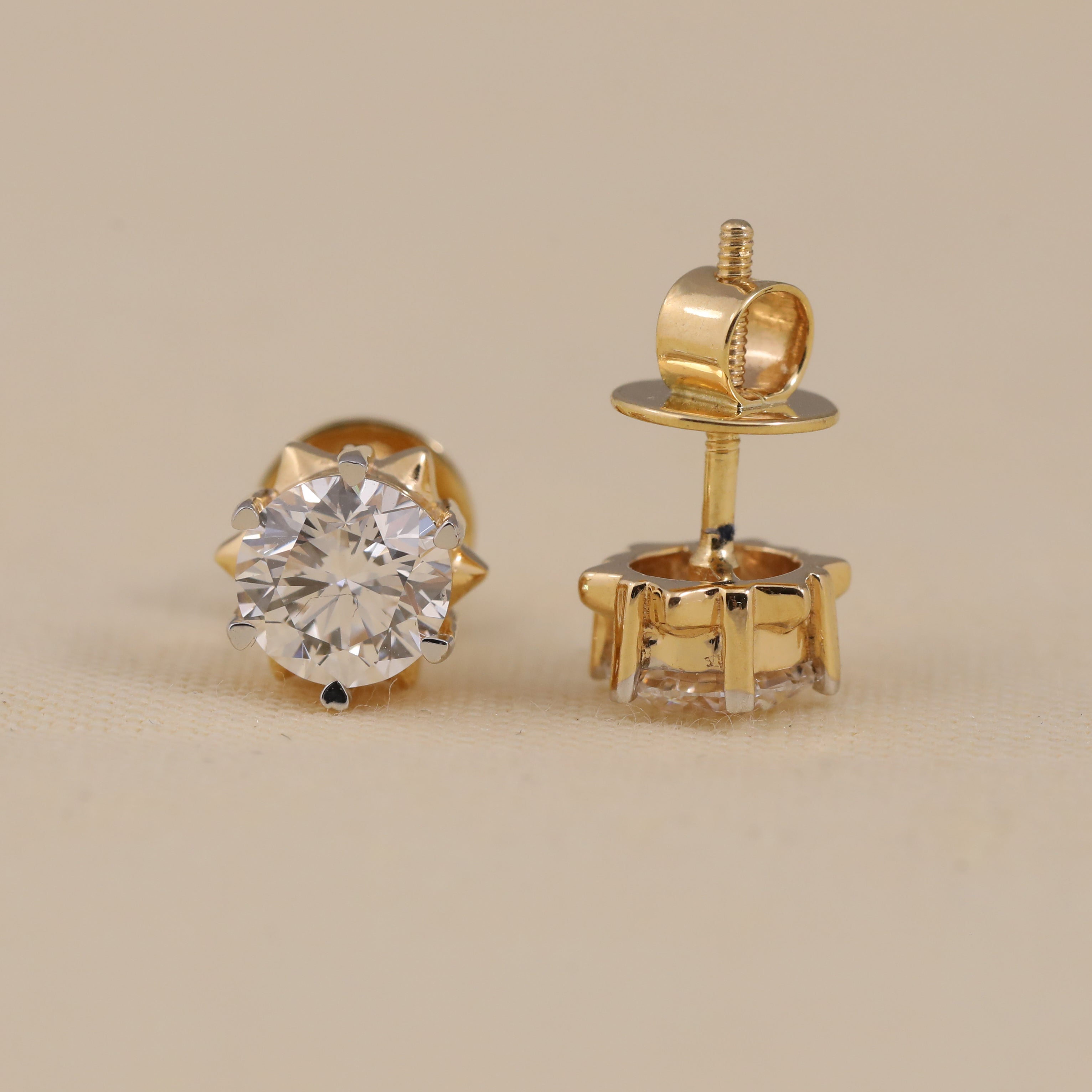 Elegant round diamond solitaire earrings suited for anniversary and party wear.