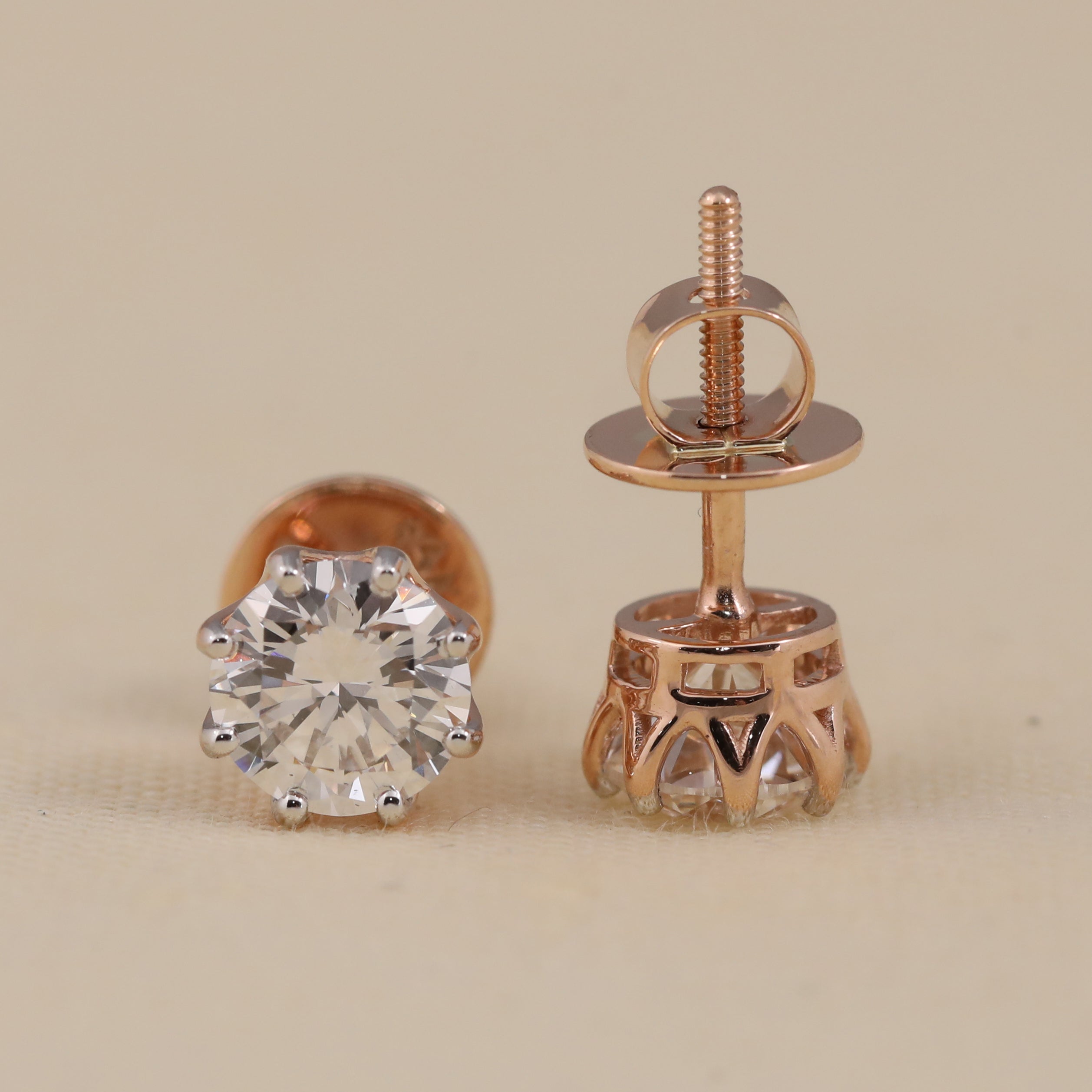 Elegant round solitaire diamond earrings suited for wedding or anniversary occasions