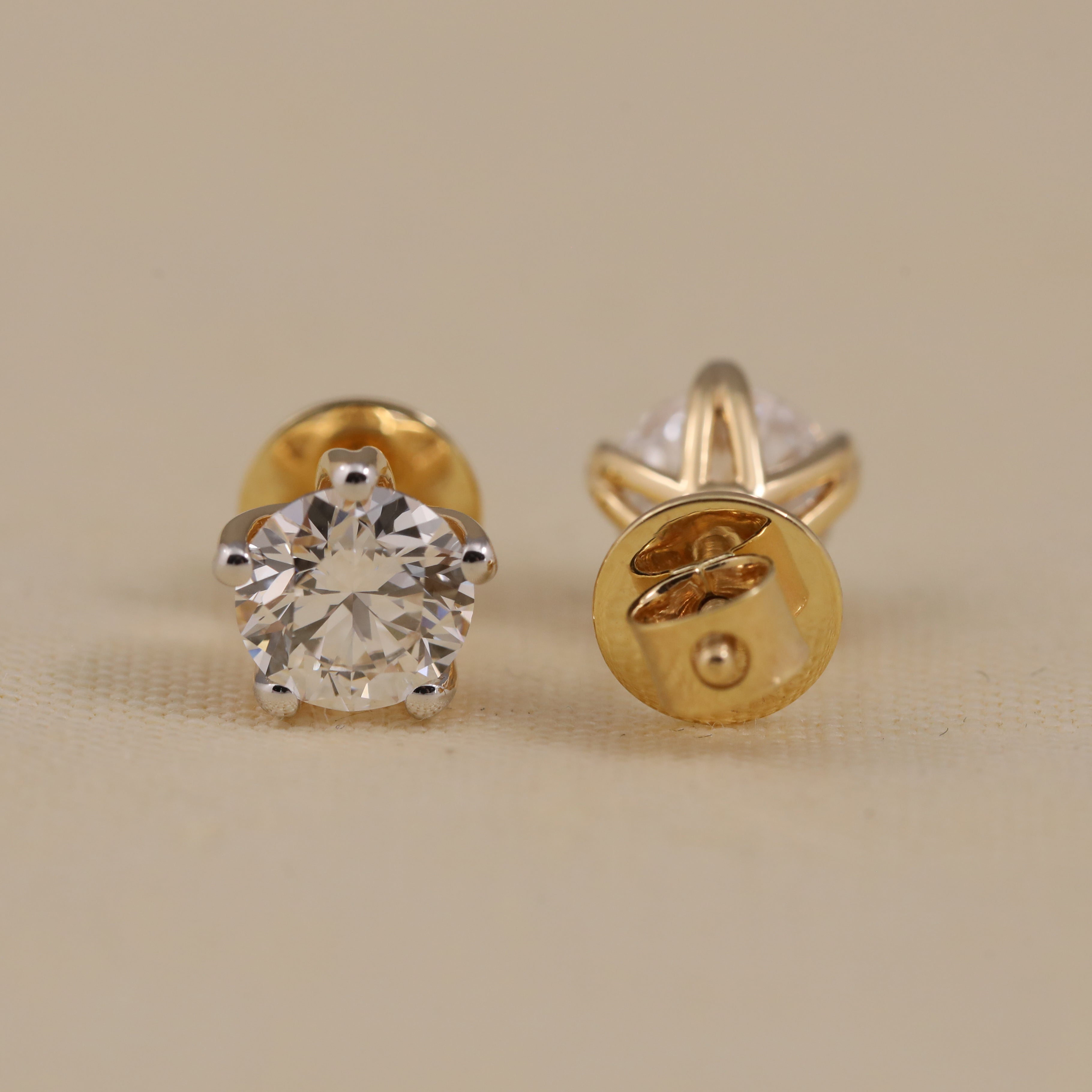 Elegant solitaire diamond studs ideal for engagement or festive occasions.