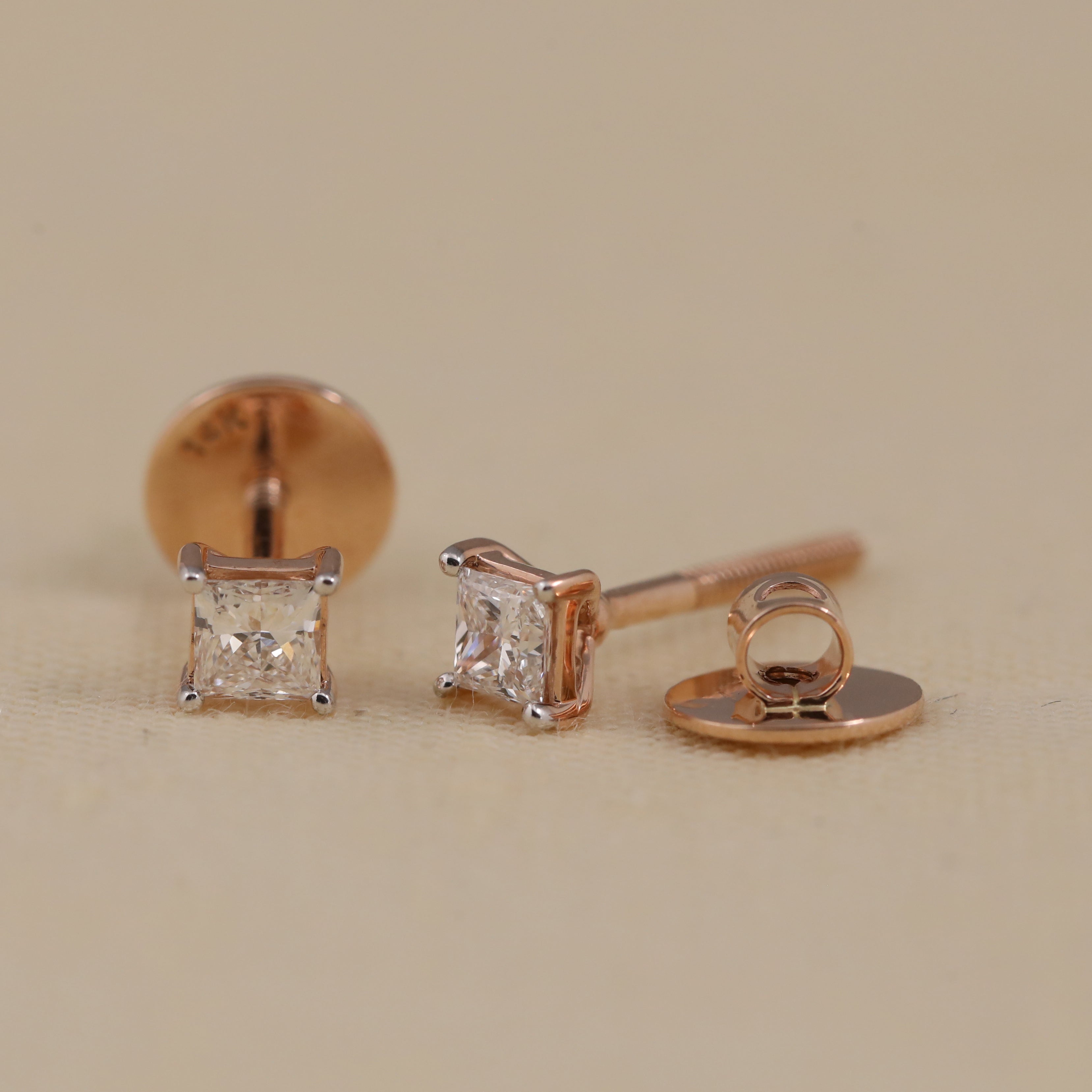 Stylish princess-cut diamond studs perfect for engagement and special events.