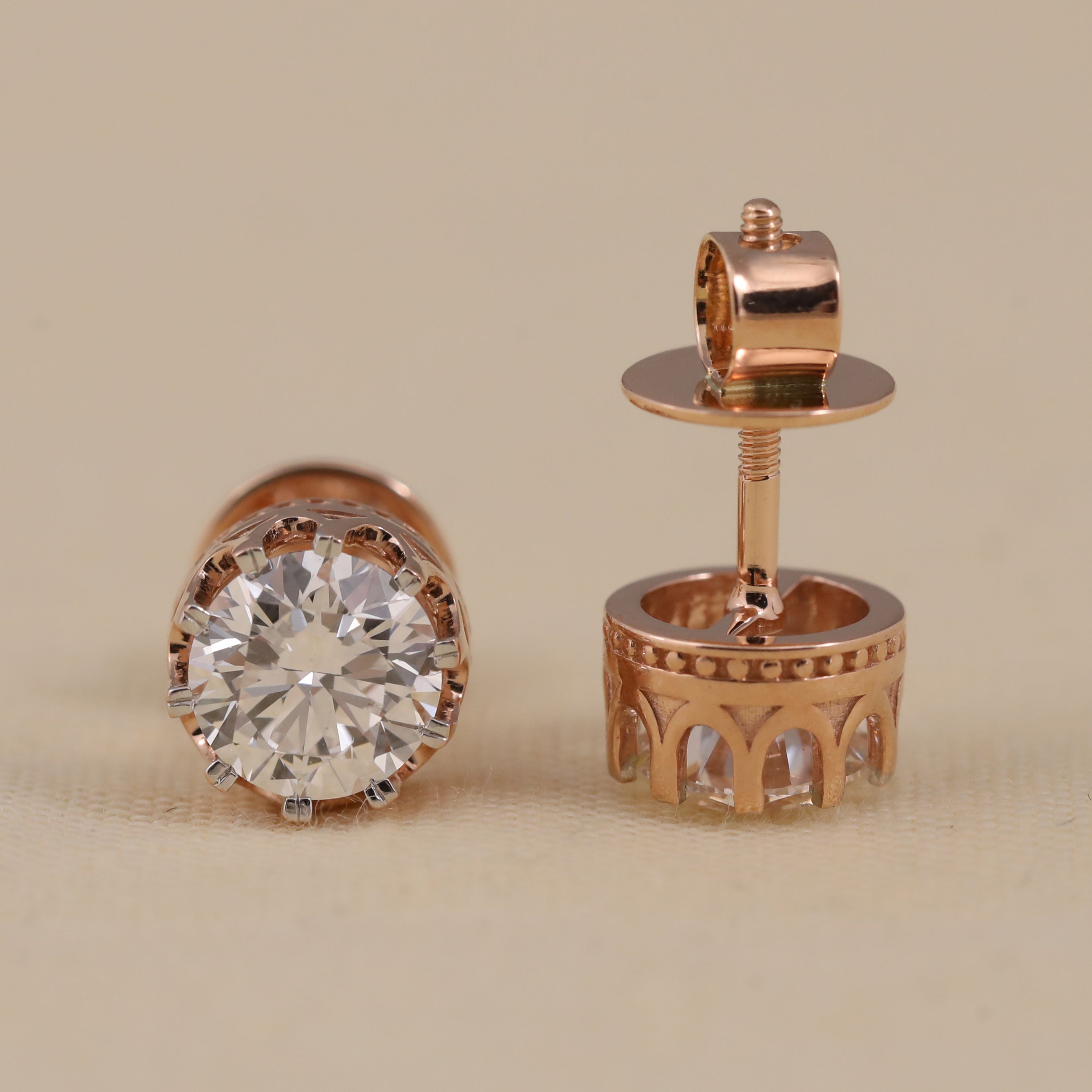 Elegant round-cut diamond studs ideal for engagement and special occasions.