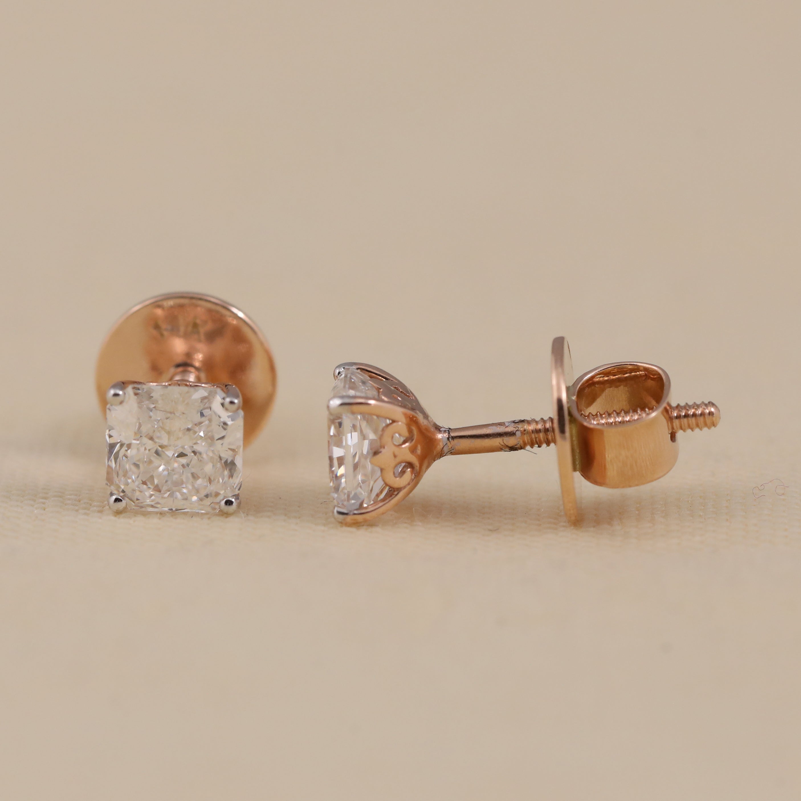 Classic cushion diamond studs perfect for birthdays or special occasions.