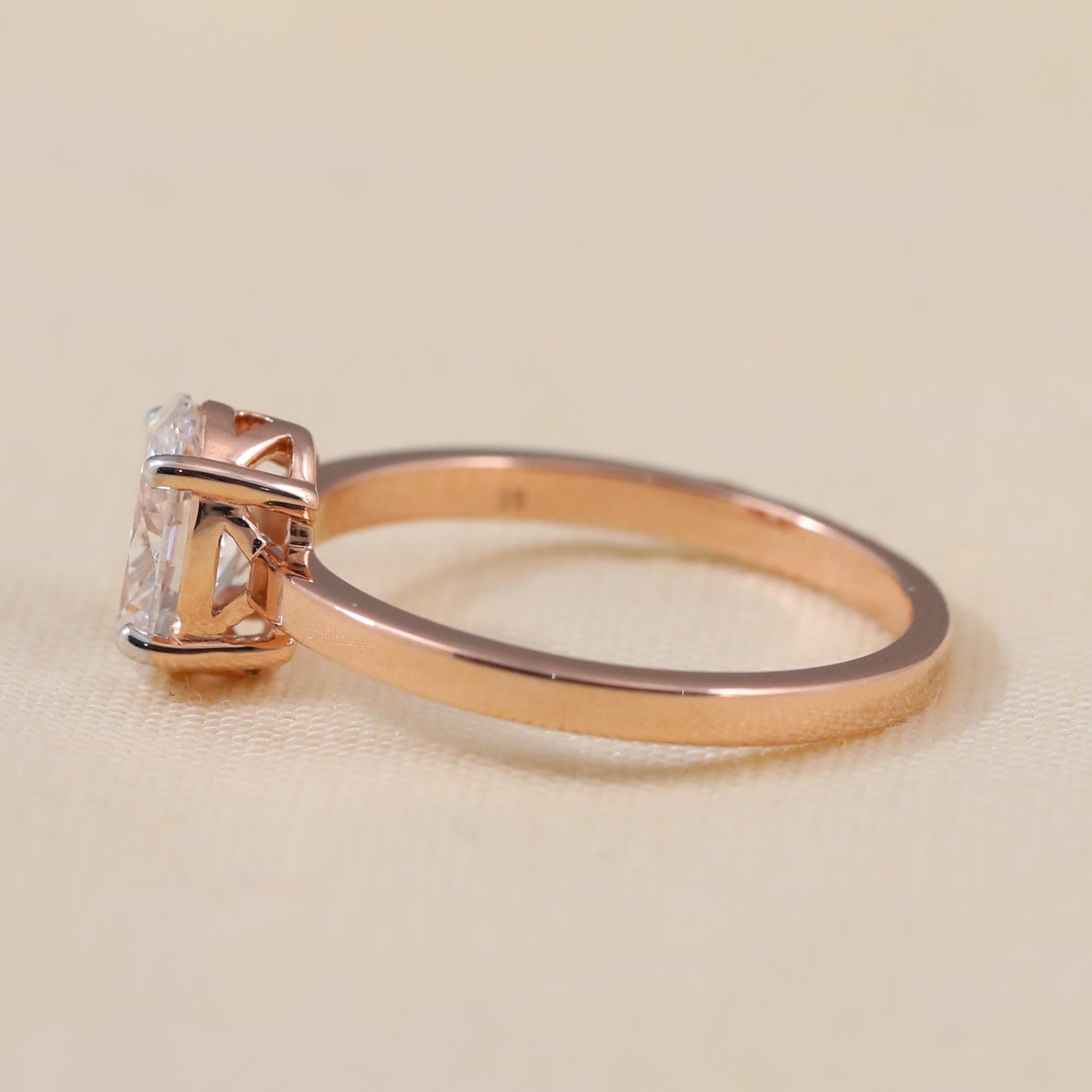 Timeless oval lab grown diamond engagement ring crafted with a simple slim band