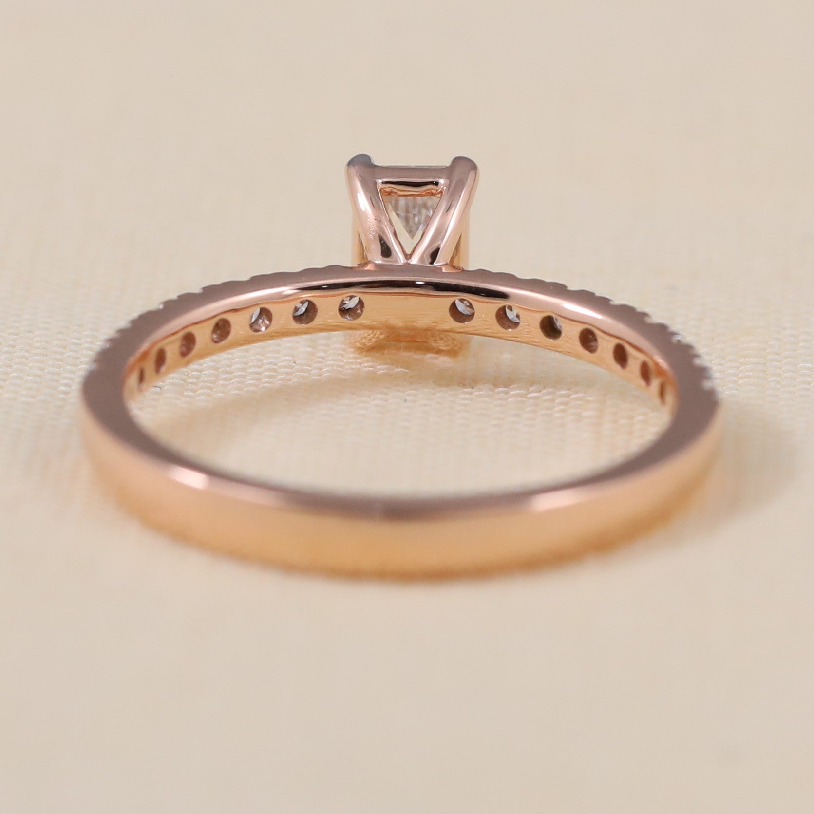 Stylish rose gold ring highlighting an emerald cut ethical lab grown diamond