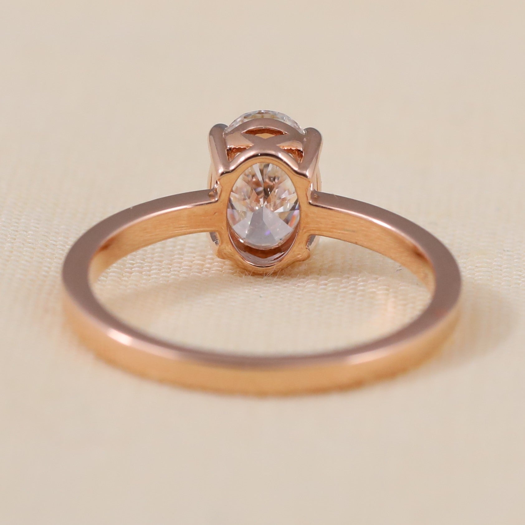 Classic oval lab grown diamond ring designed with a smooth polished band.