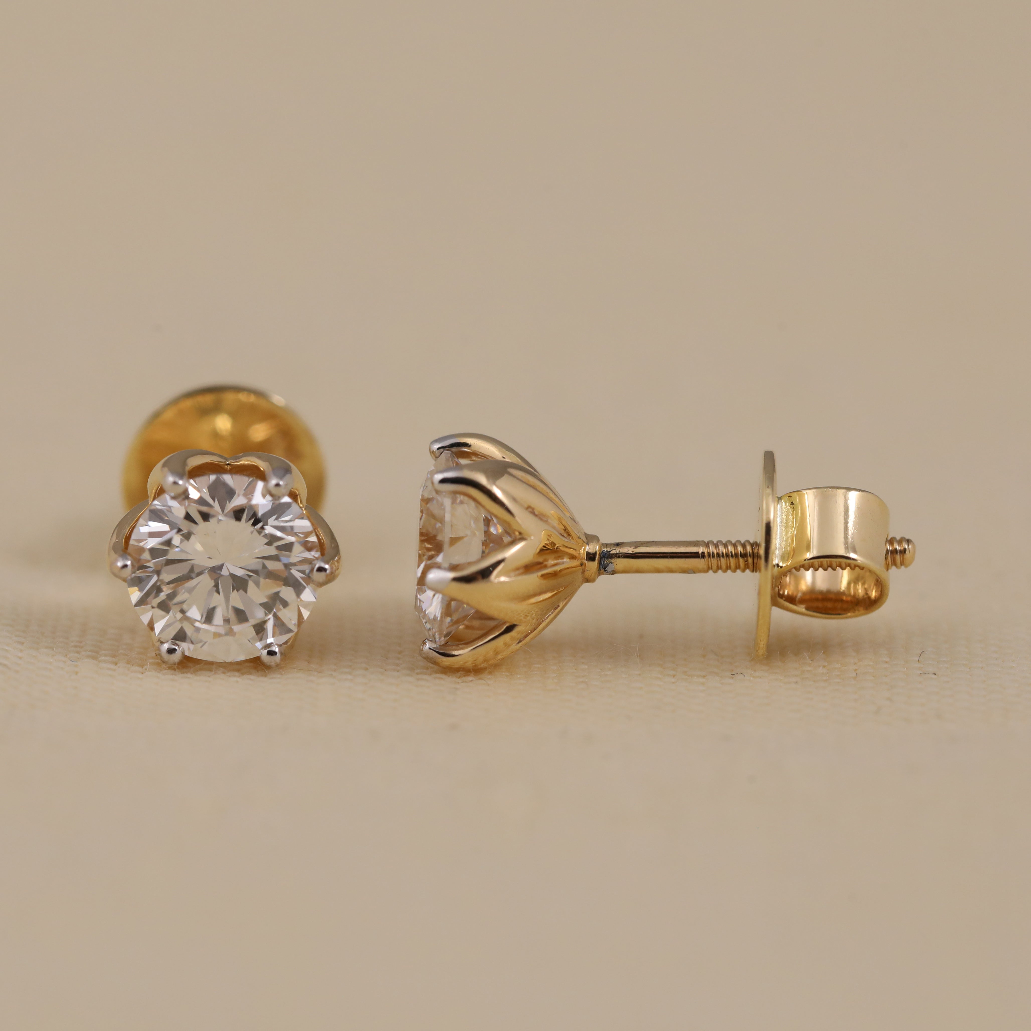 Brilliant round-cut diamond earrings suited for wedding and festive occasions.
