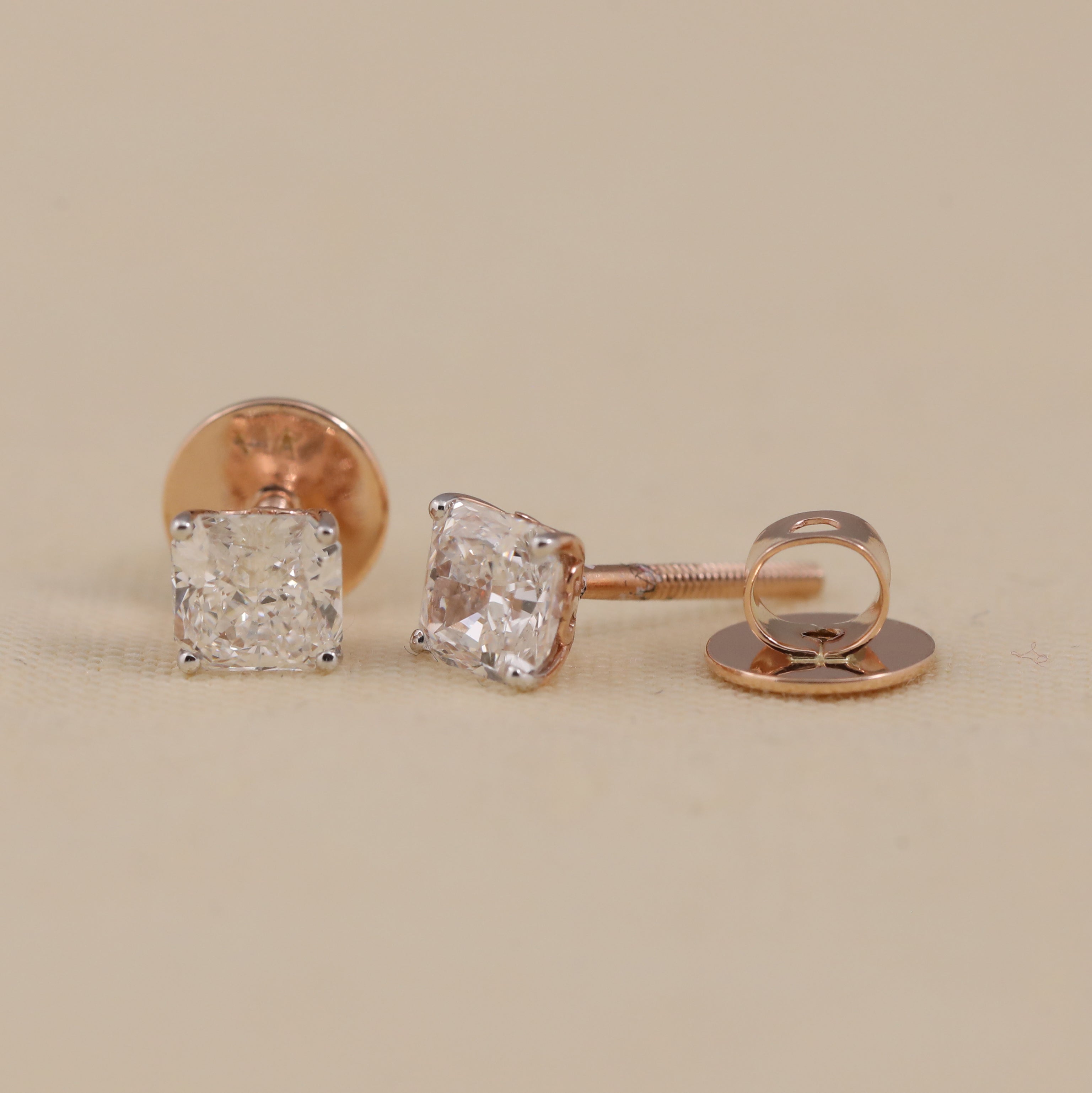Brilliant cushion cut diamond earrings designed for party wear or celebrations.