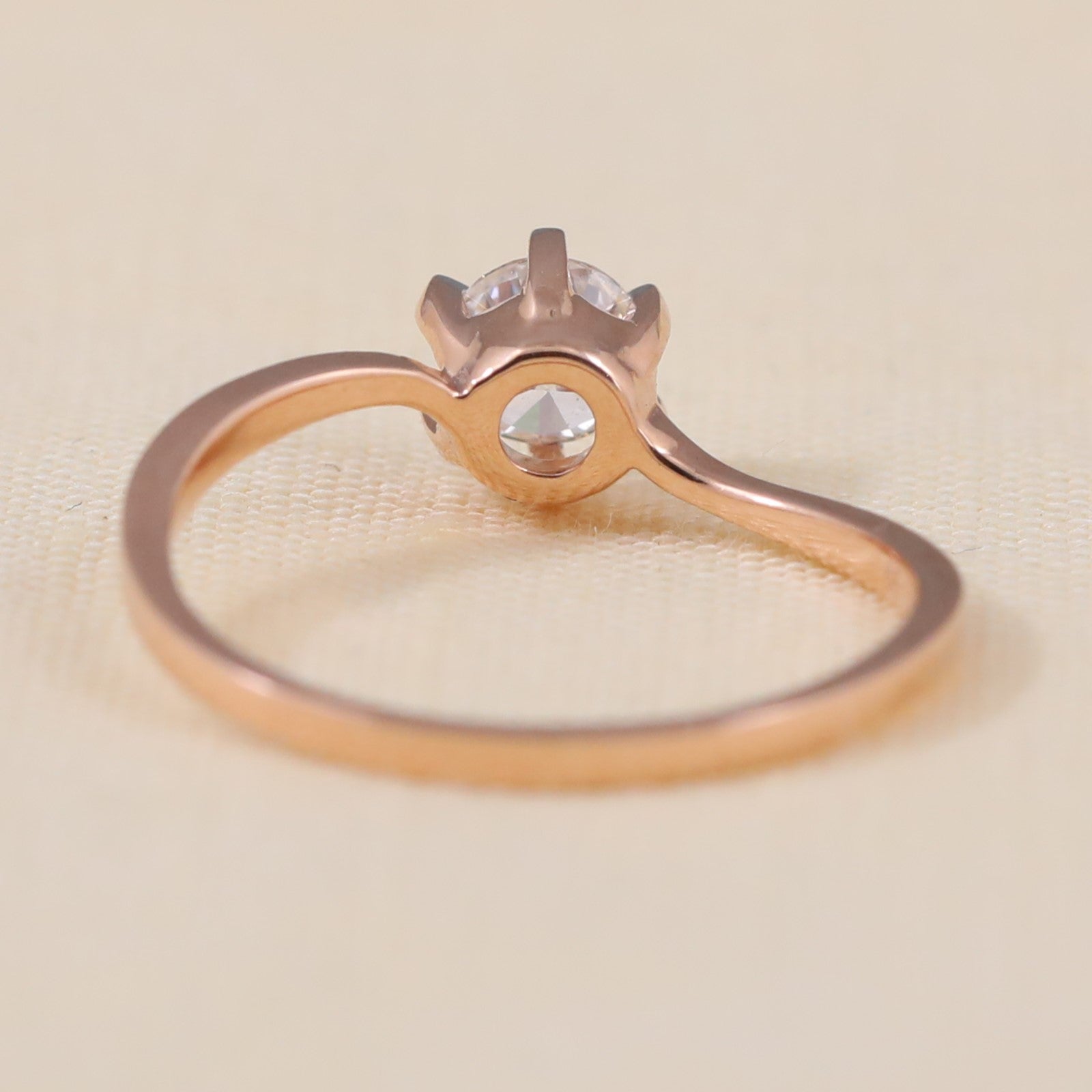 Timeless solitaire ring featuring a radiant round ethical lab grown diamond