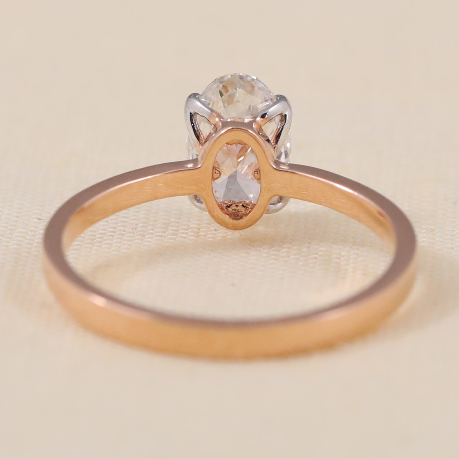 Classic oval lab grown diamond ring designed with a smooth modern band