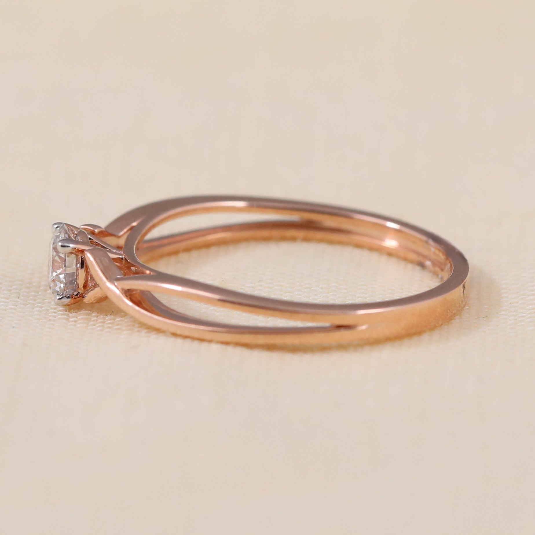 Modern solitaire ring with a stylish twisted band and lab grown diamond