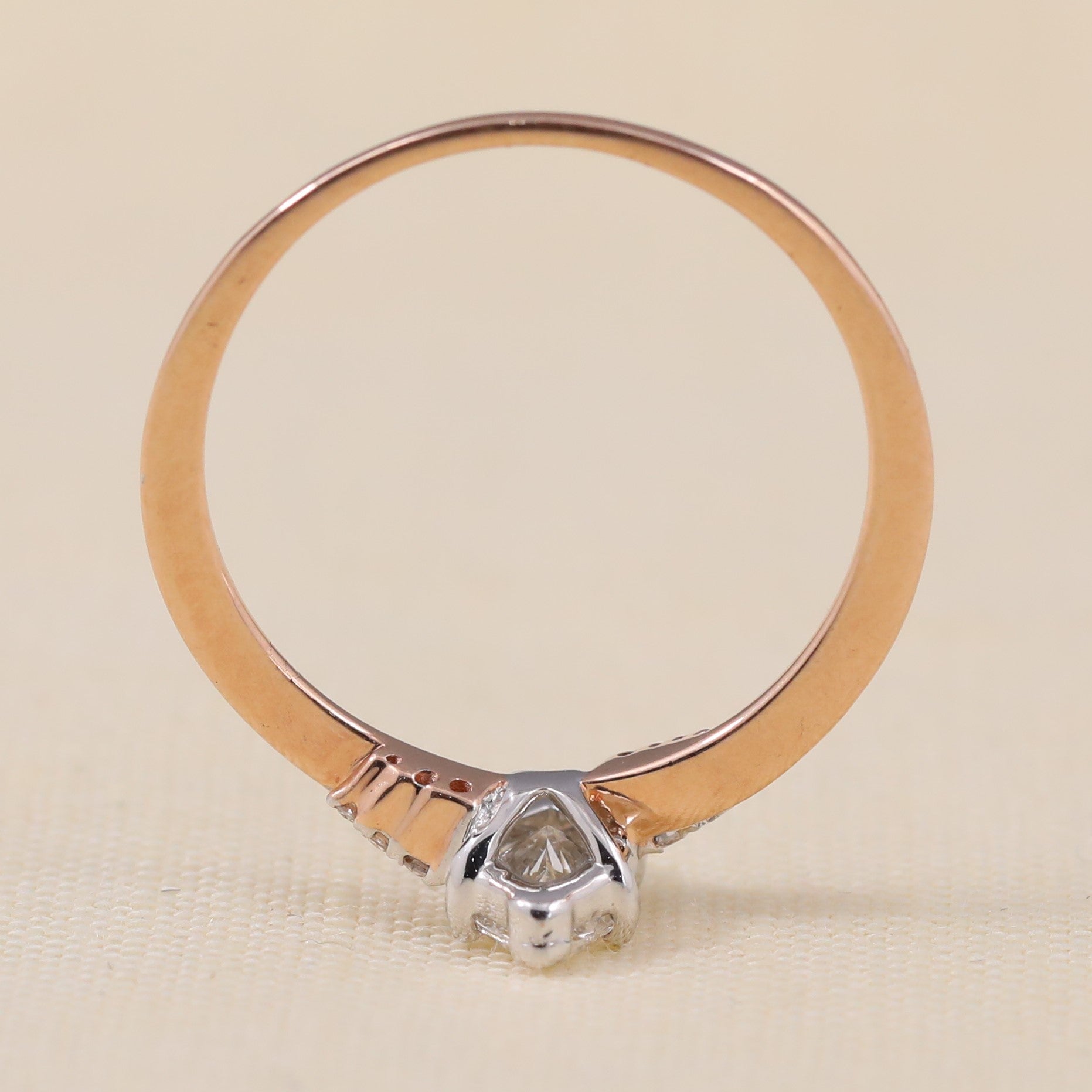 Elegant marquise solitaire ring highlighted by shimmering accent lab grown diamonds