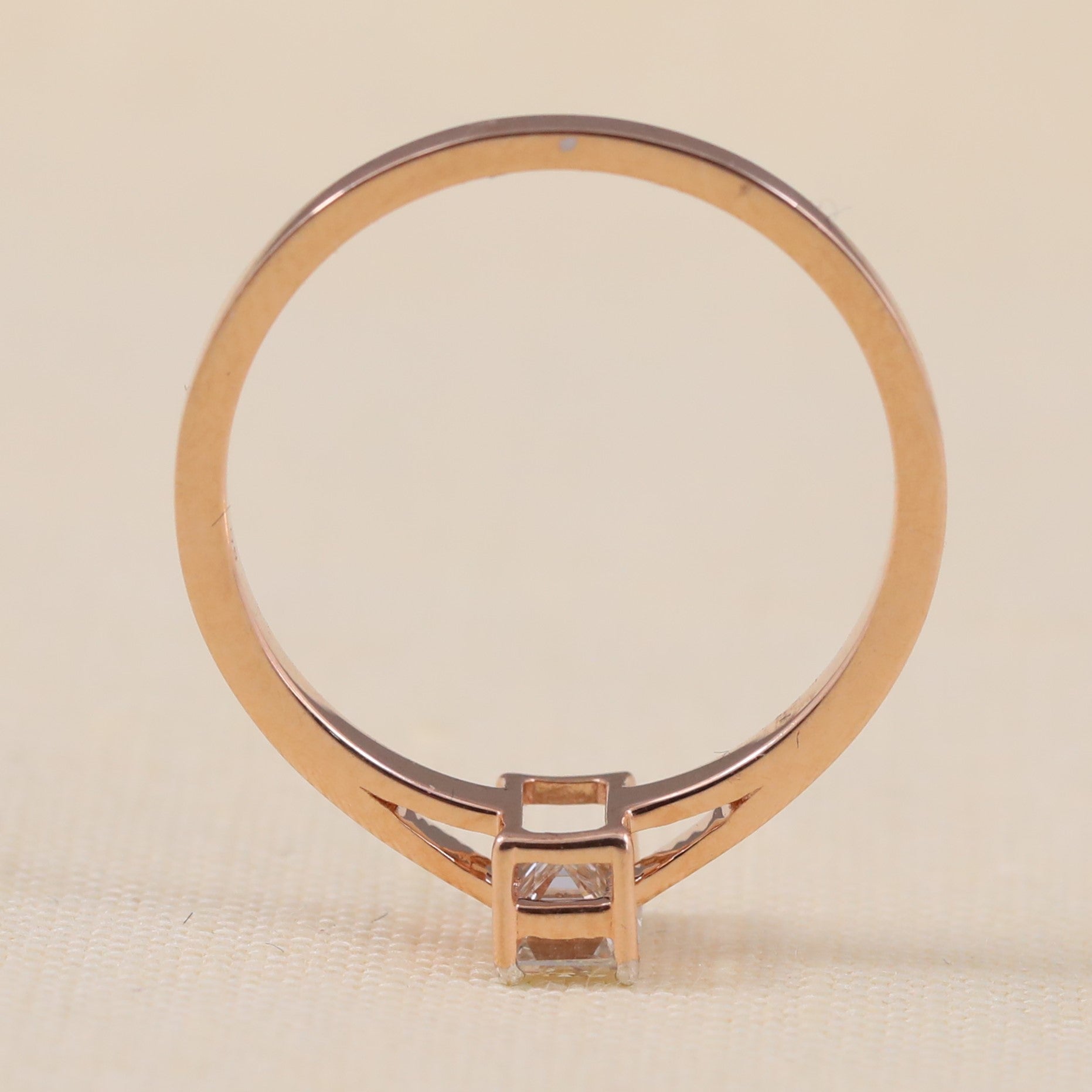 Classic emerald cut lab grown diamond ring crafted with a smooth simple band