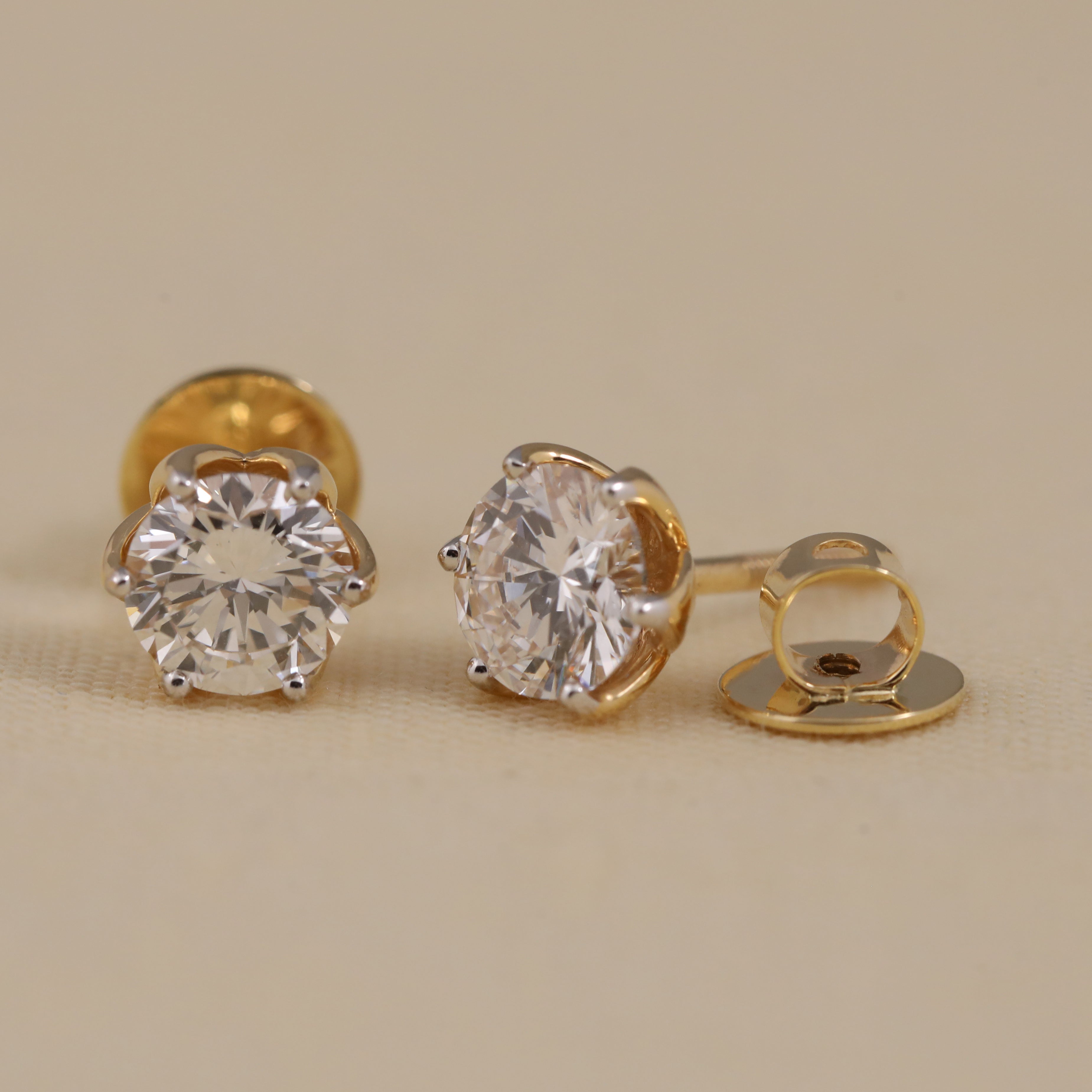 Luxurious round diamond earrings ideal for engagement gifting and special events.