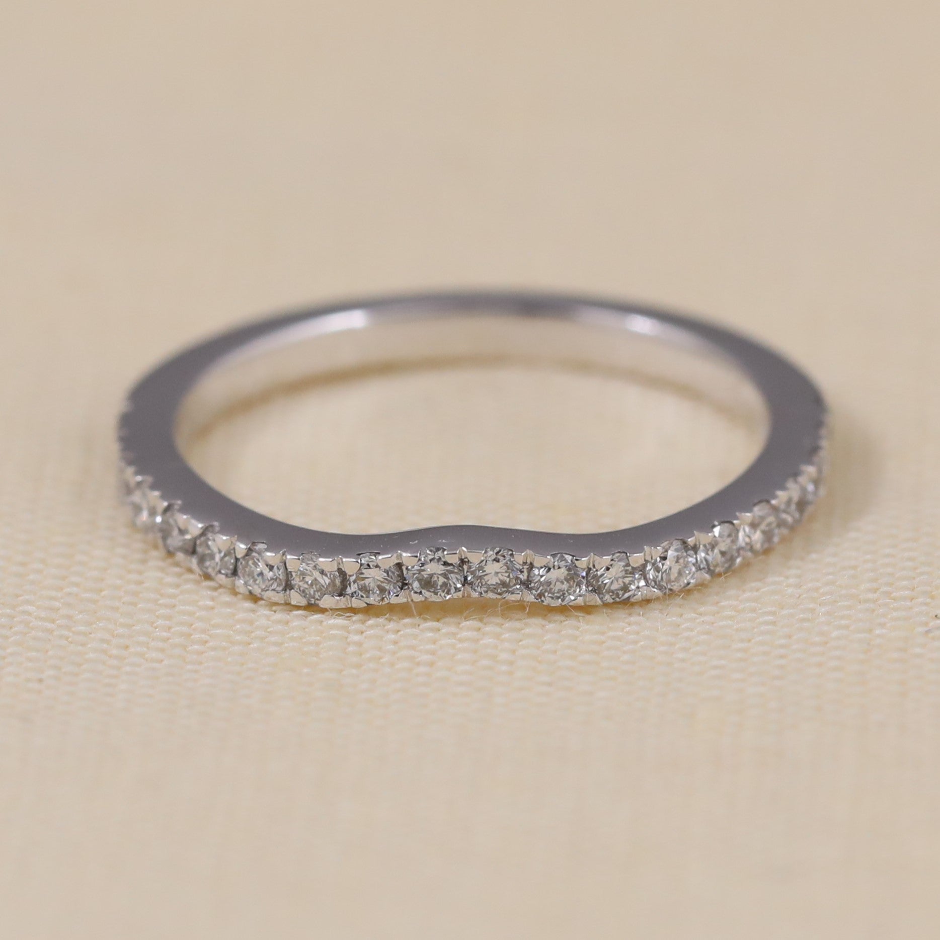 Delicate diamond pavé band ring designed for bridal sets, stacking, or elegant everyday wear