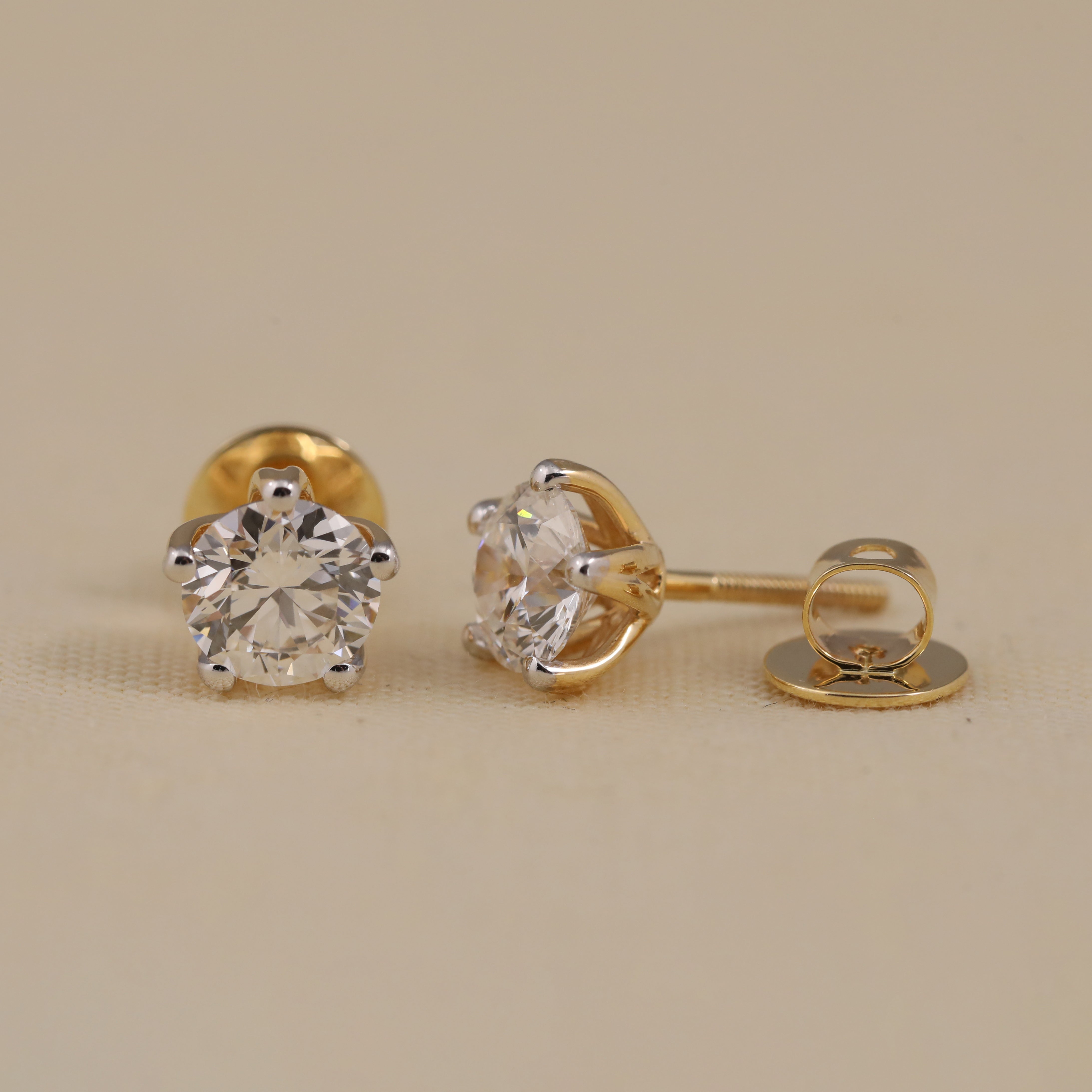 Timeless round diamond earrings ideal for anniversary and festive moments.