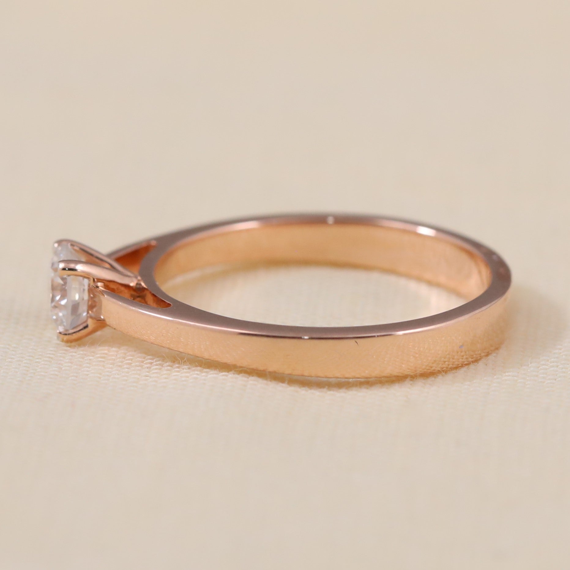 Minimalist solitaire ring showcasing a brilliant round lab grown diamond center