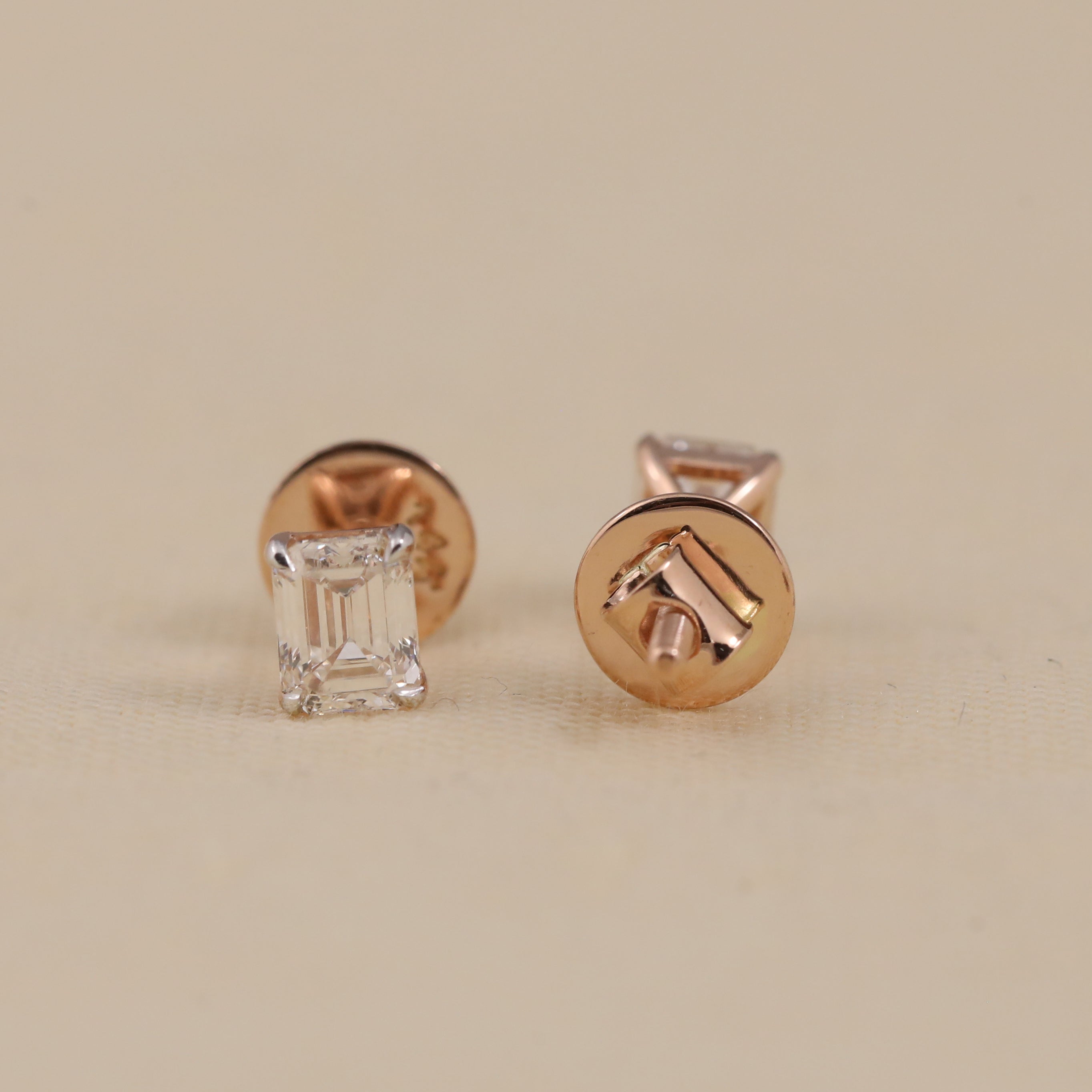 Elegant emerald cut diamond studs perfect for anniversary or birthday celebrations.