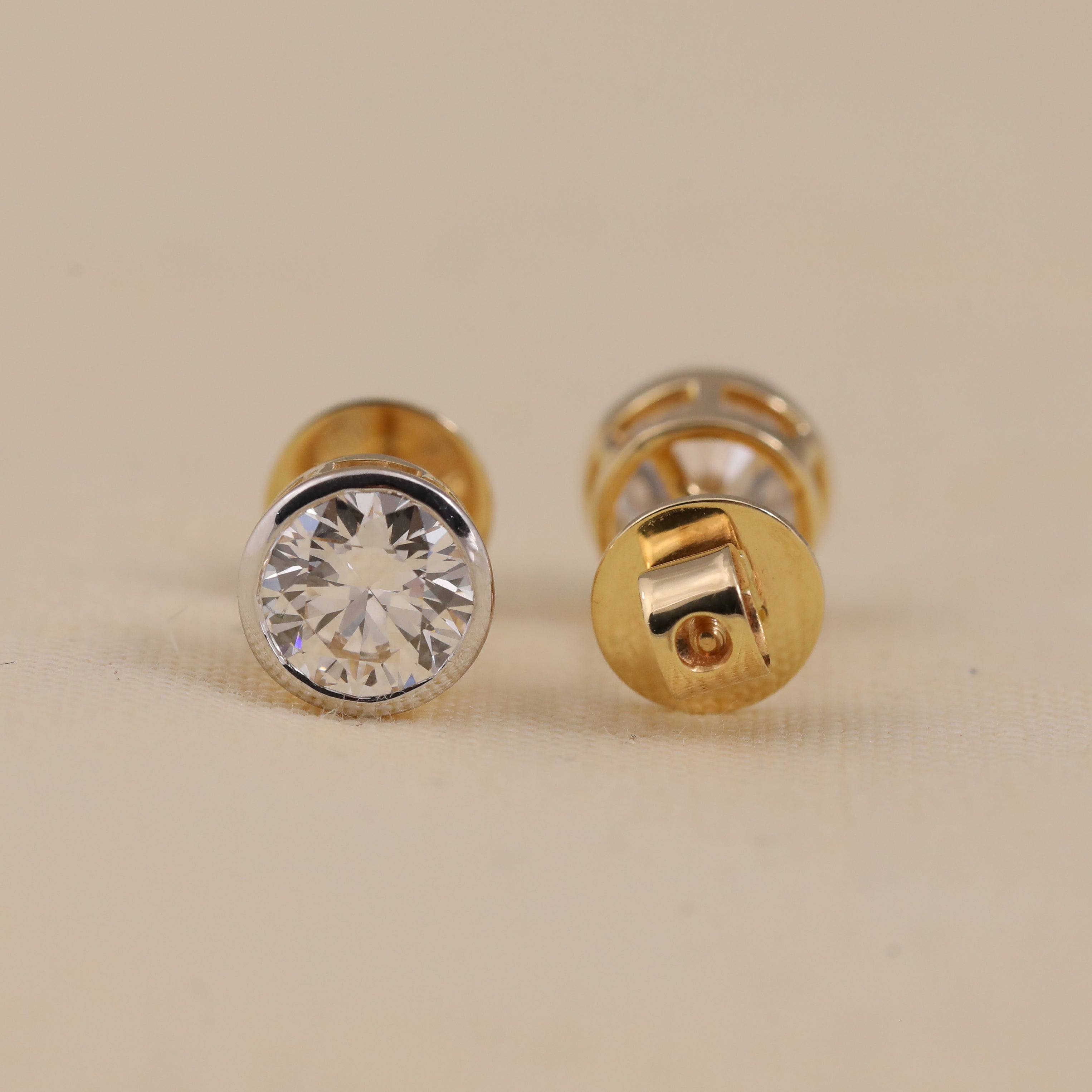 Elegant round diamond bezel studs perfect for birthday or anniversary gifts
