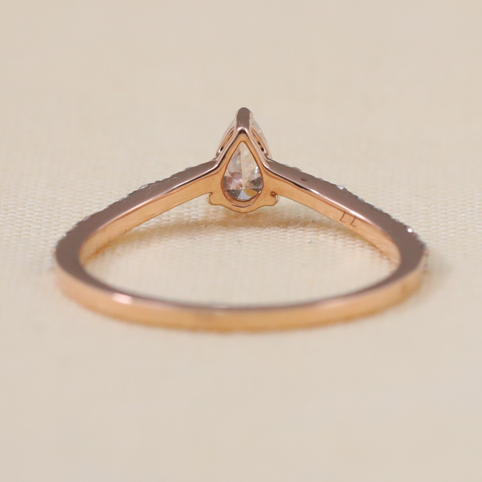 Bridal pear lab grown diamond ring crafted with a slim pavé shank