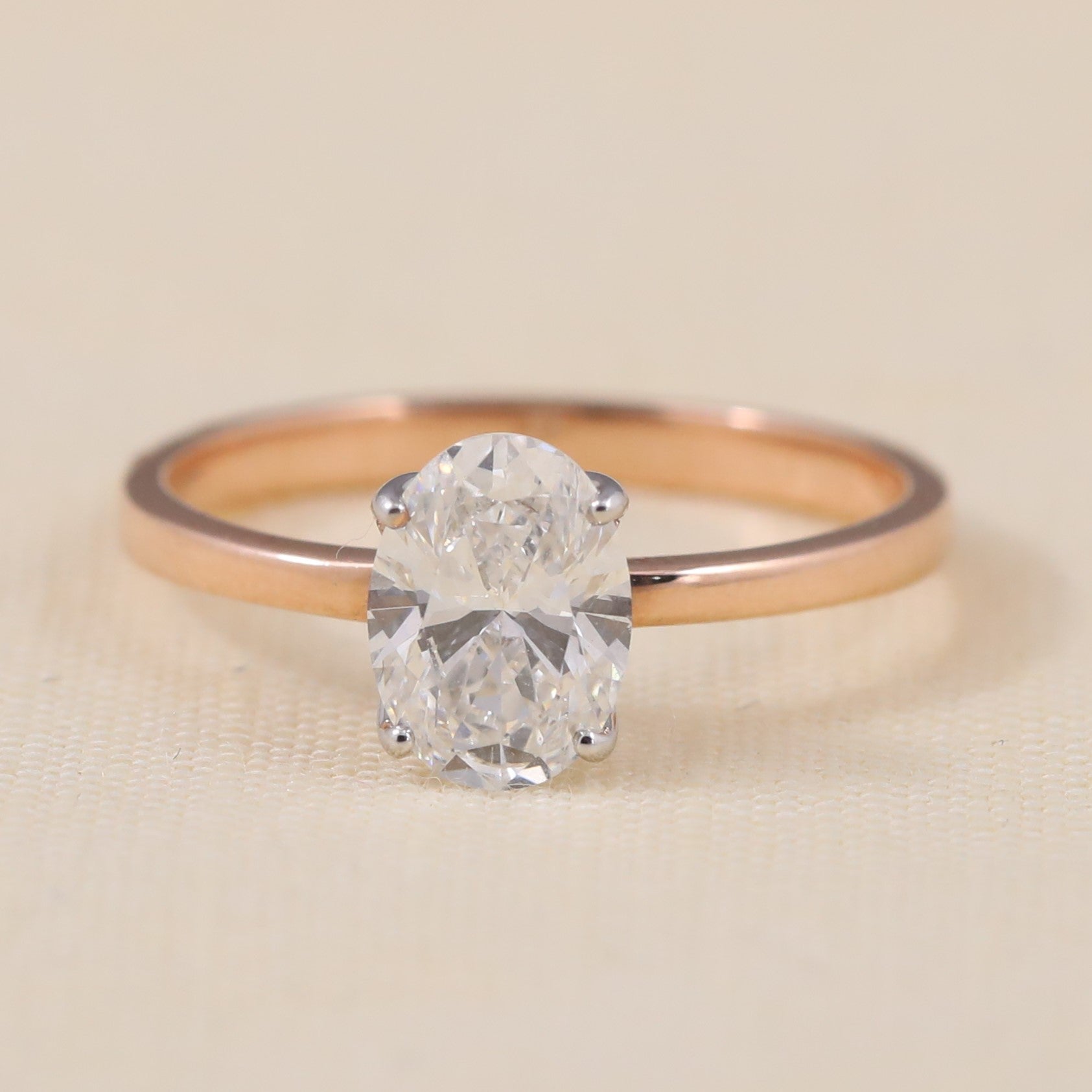 Oval lab grown diamond solitaire ring featuring a sleek minimalist band design