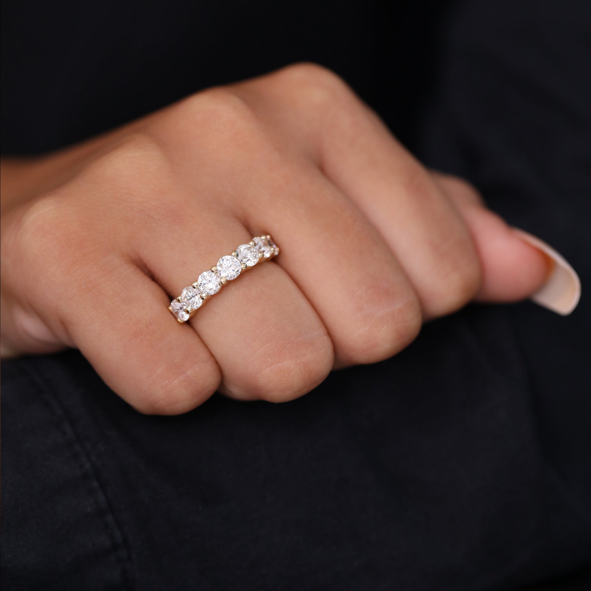 Minimalist yellow gold diamond band featuring round brilliant 7 stone ring
