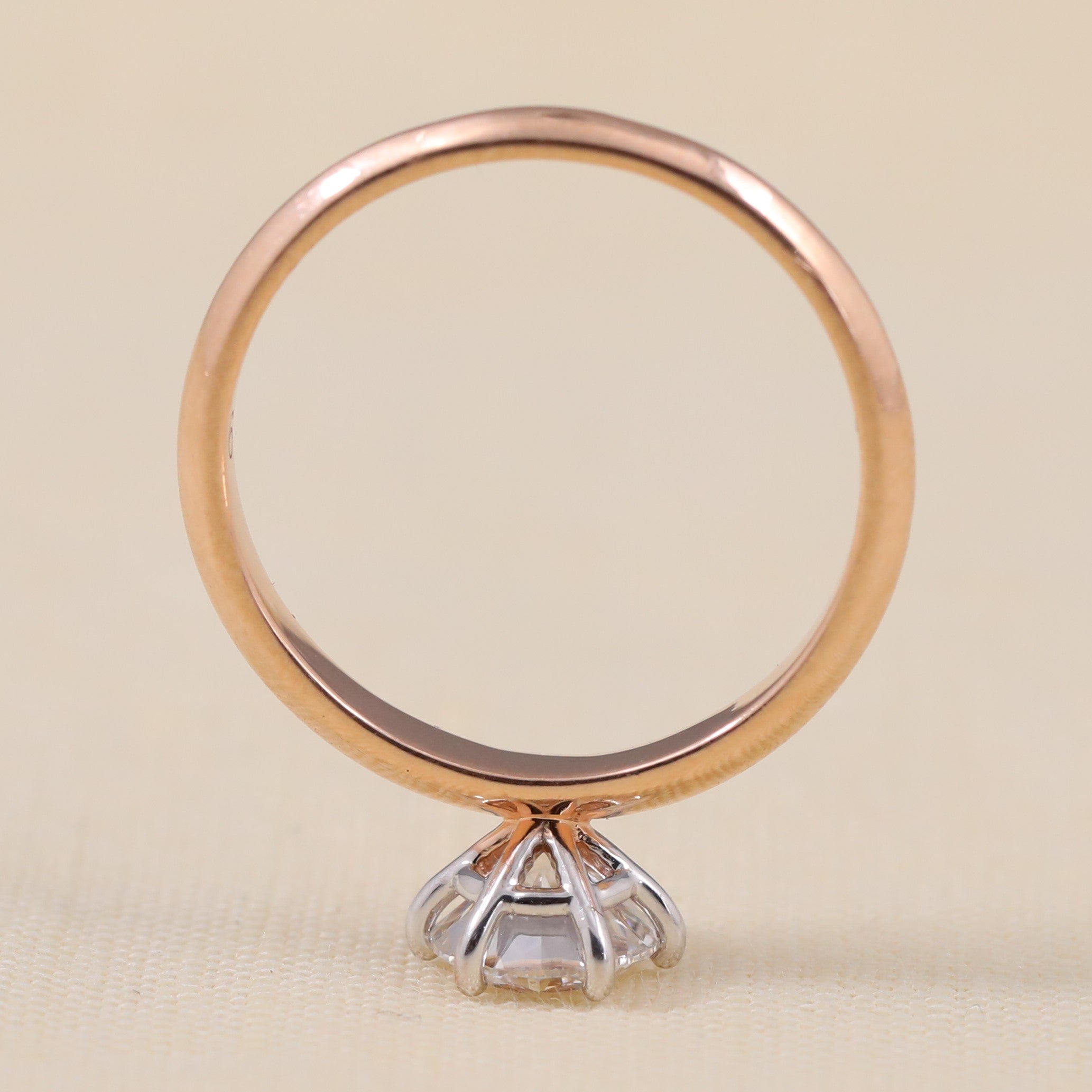 Minimalist solitaire ring highlighting a bright round ethical lab grown diamond