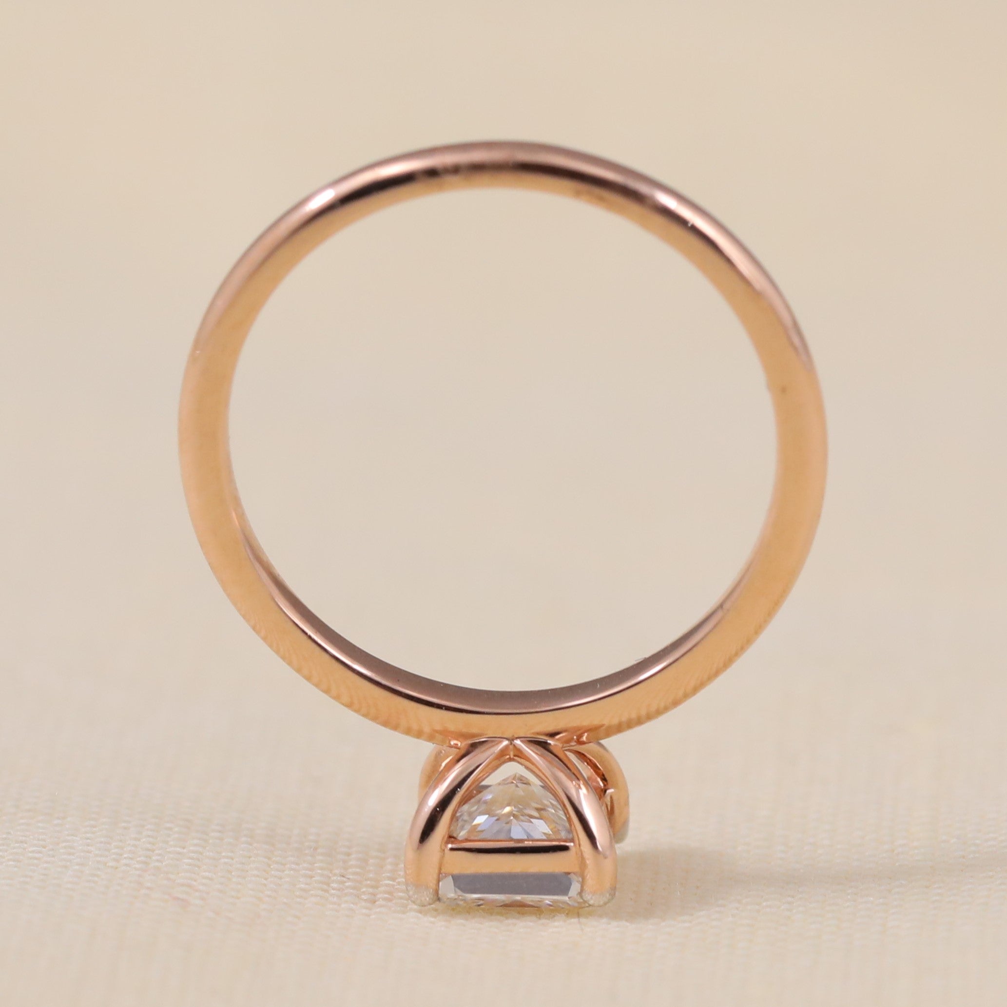 Minimalist band ring highlighting a sparkling princess cut ethical lab grown diamond