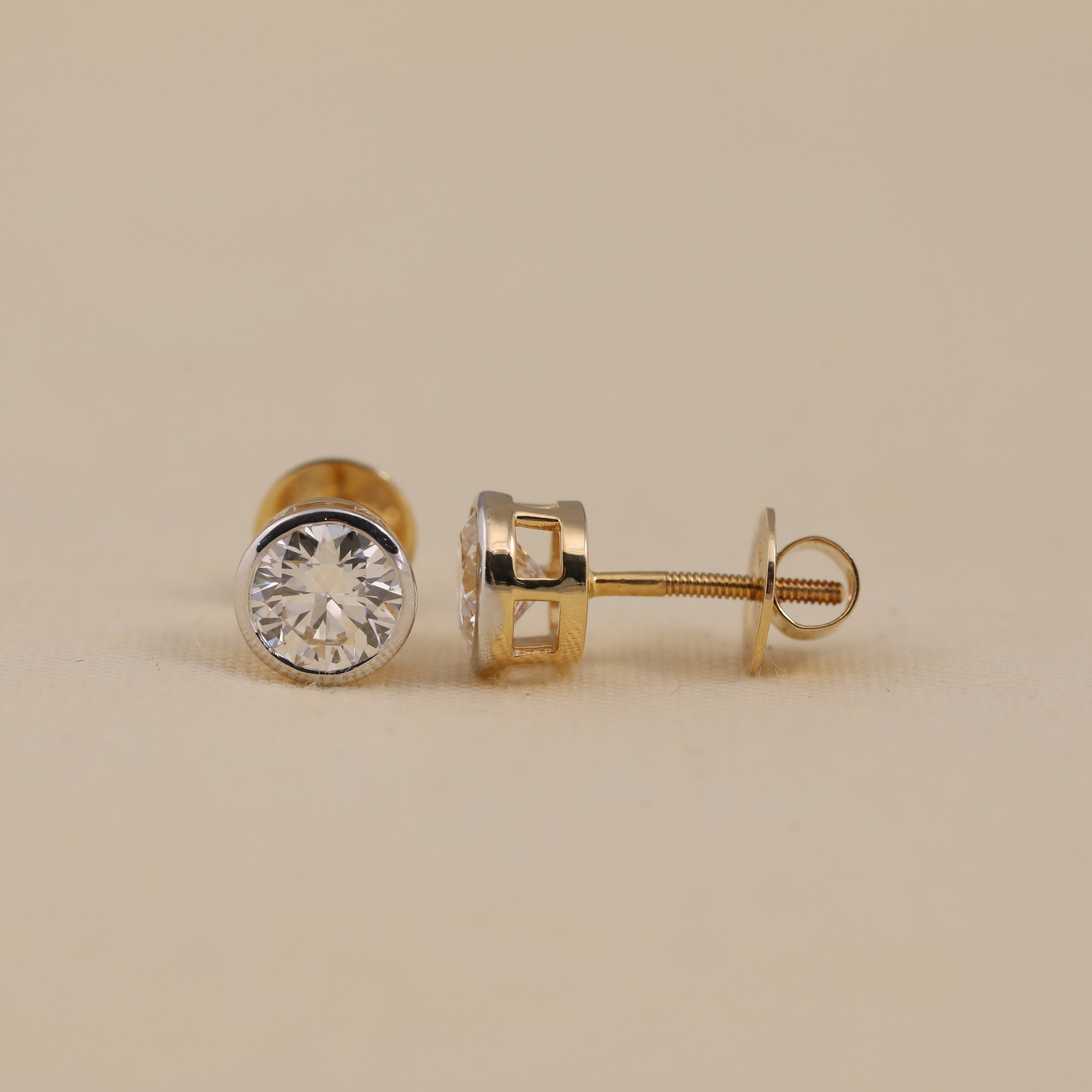 Timeless round diamond bezel earrings suited for office or evening events